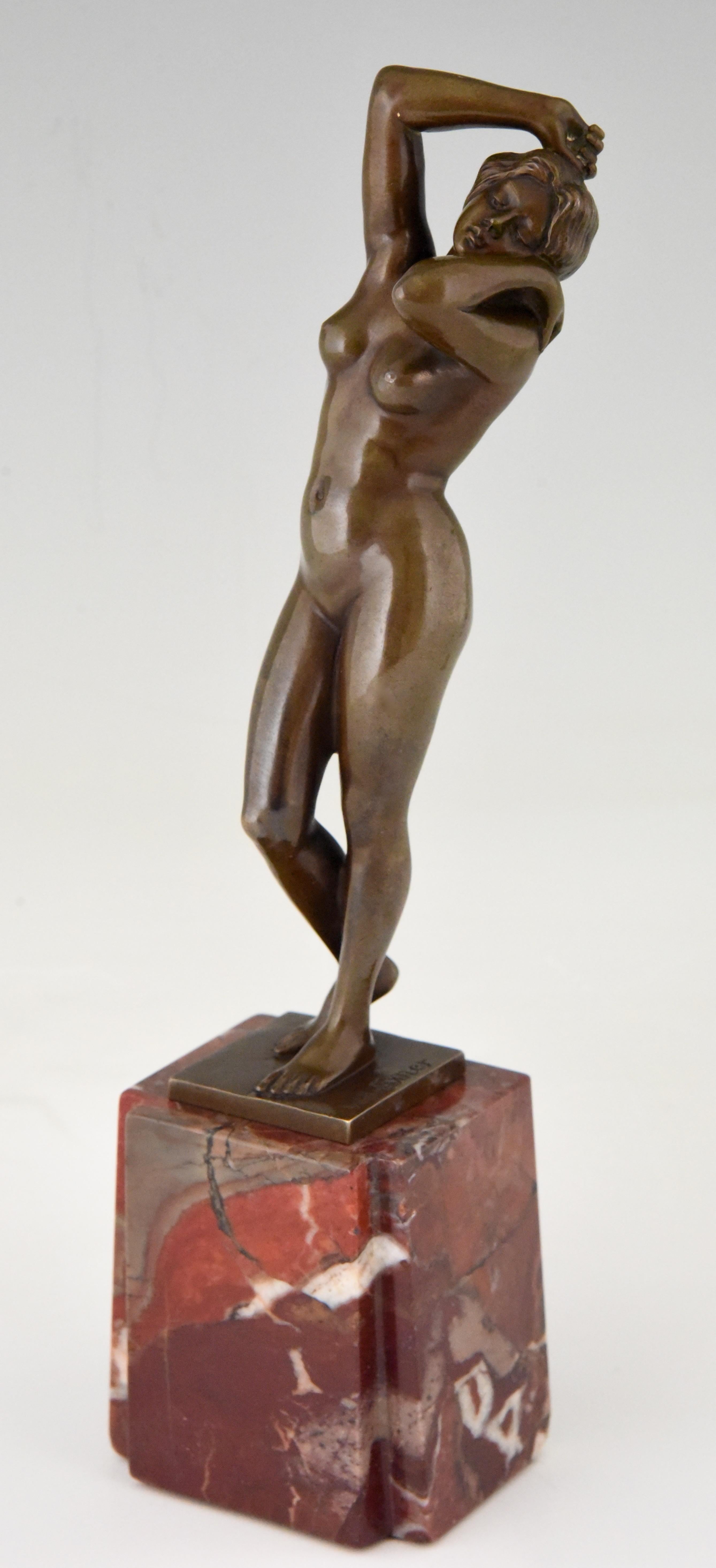 Art Nouveau bronze sculpture of a standing nude. The bronze is signed by the German artist Willi Exner and stands on a marble base, circa 1910.