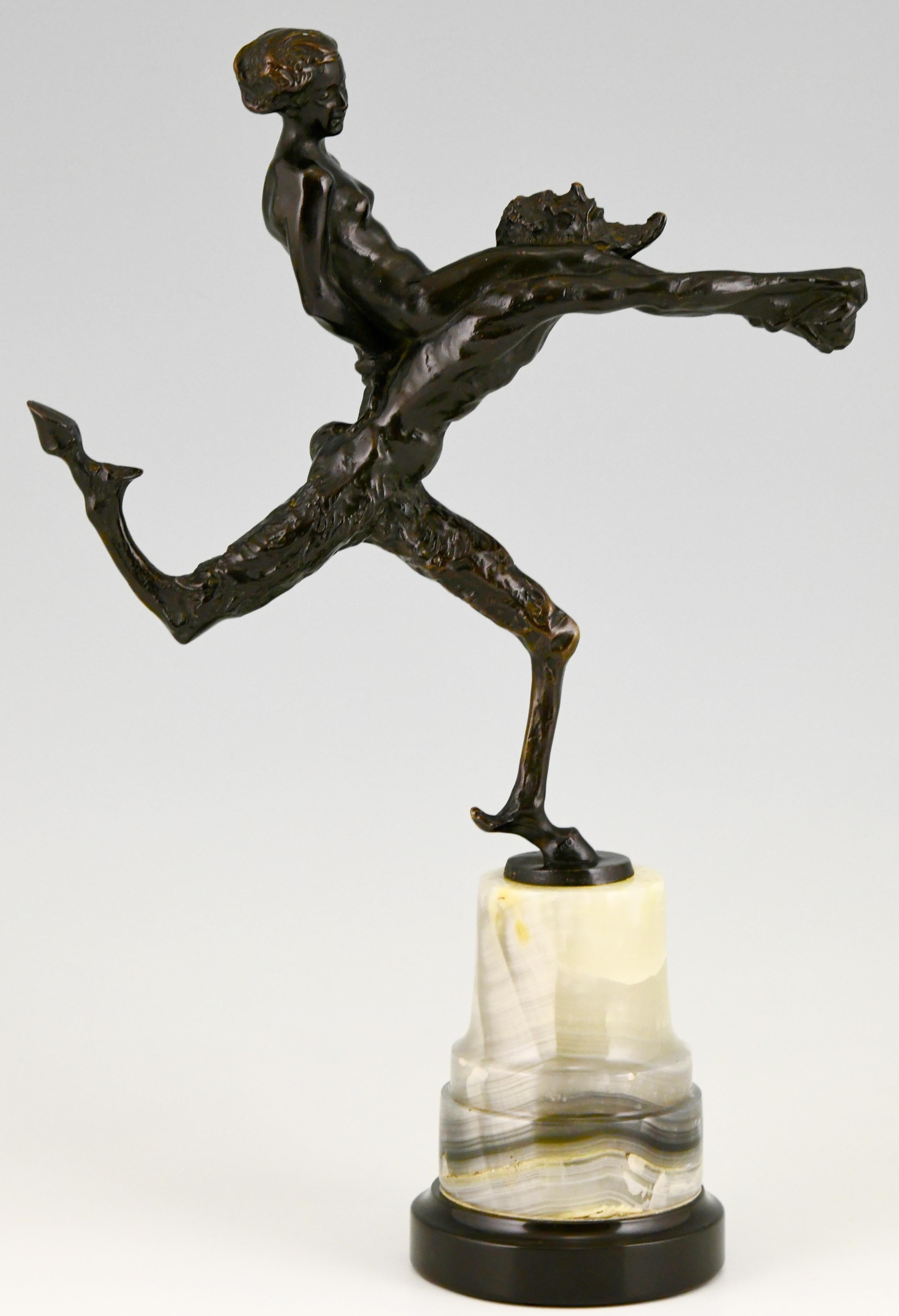 Art Nouveau bronze sculpture of a running satyr with a nude on his back.
By the German artist Hans Piffrader (1888-1950)
Beautiful patina and mounted on a fine circular marble base,
Ca. 1900. 

Literature:
“Dictionnaire des peintres,