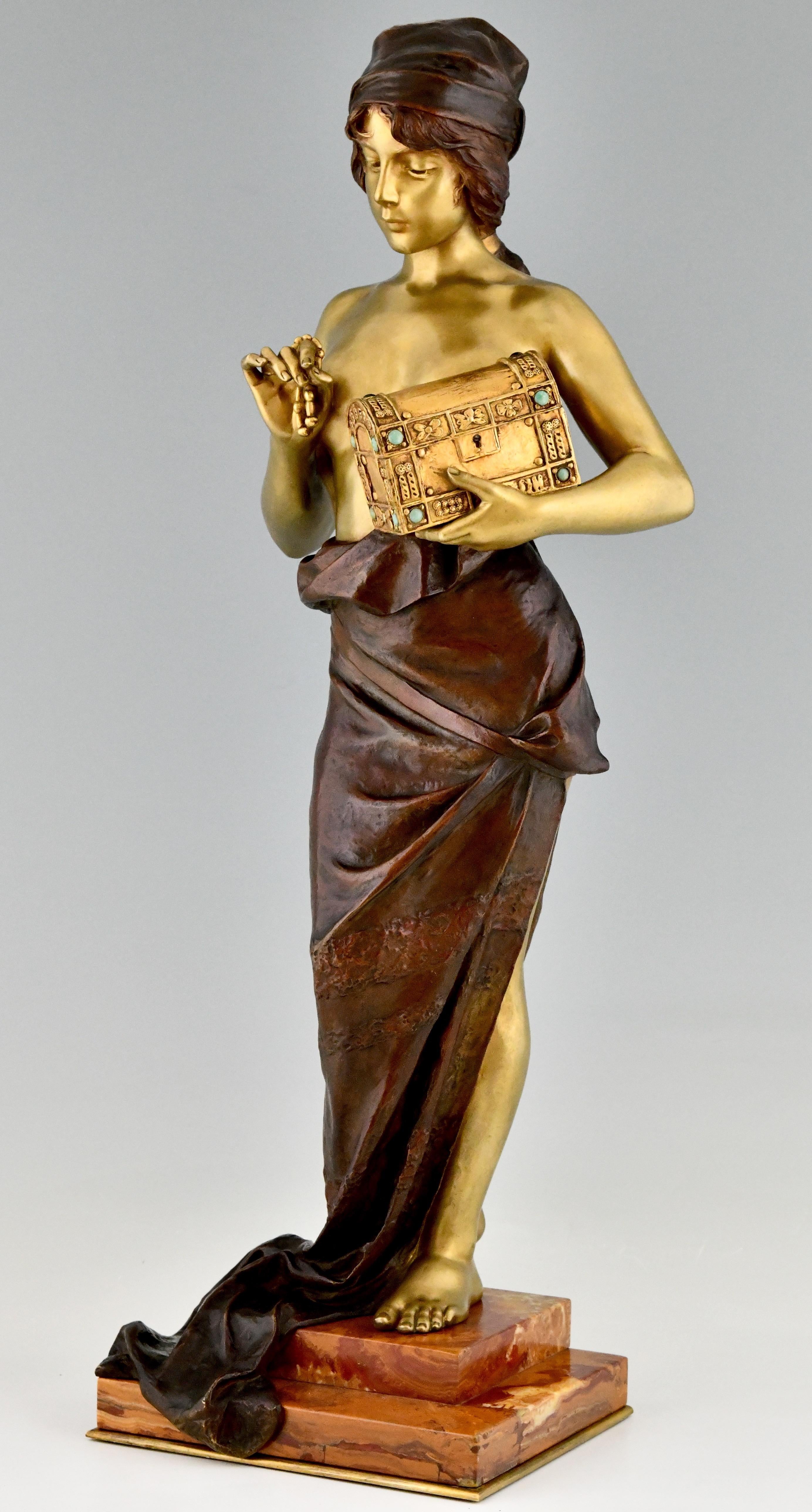Art Nouveau bronze sculpture of a semi nude lady holding a jewelry casket by Emmanuel Villanis. impressive size. This model is ver hard to find. The bronze statue has a beautiful patina and stands on a fine marble base. France ca. 1900.
