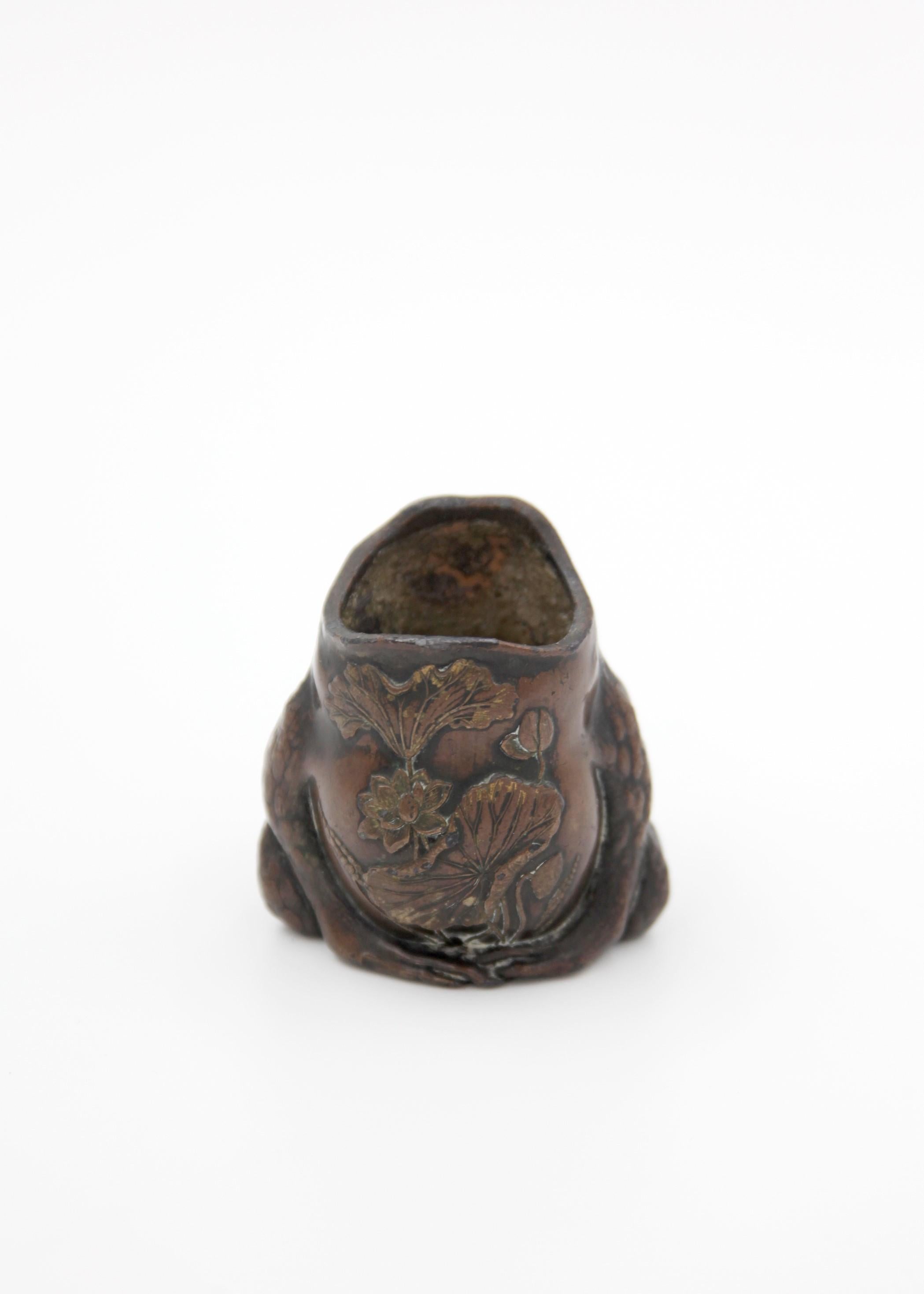 Enjoy a serving of sheer whimsy with this unique Art Nouveau bronze spoon warmer designed as a toad. Reflecting a unique aspect of late 19th to early 20th-century artistry, it acts as a fun conversation starter as well as an intriguing piece of