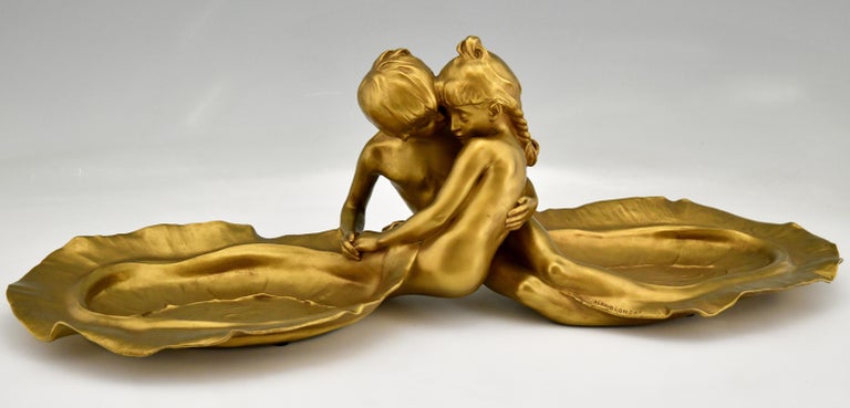 Art Nouveau bronze tray with young couple kissing signed by Max Blondat with Siot Foundry mark.
First kiss, a gilt bronze sculptural leaf shaped tray with a boy and girl embracing, impressive size. 
France 1900.

This model is illustrated