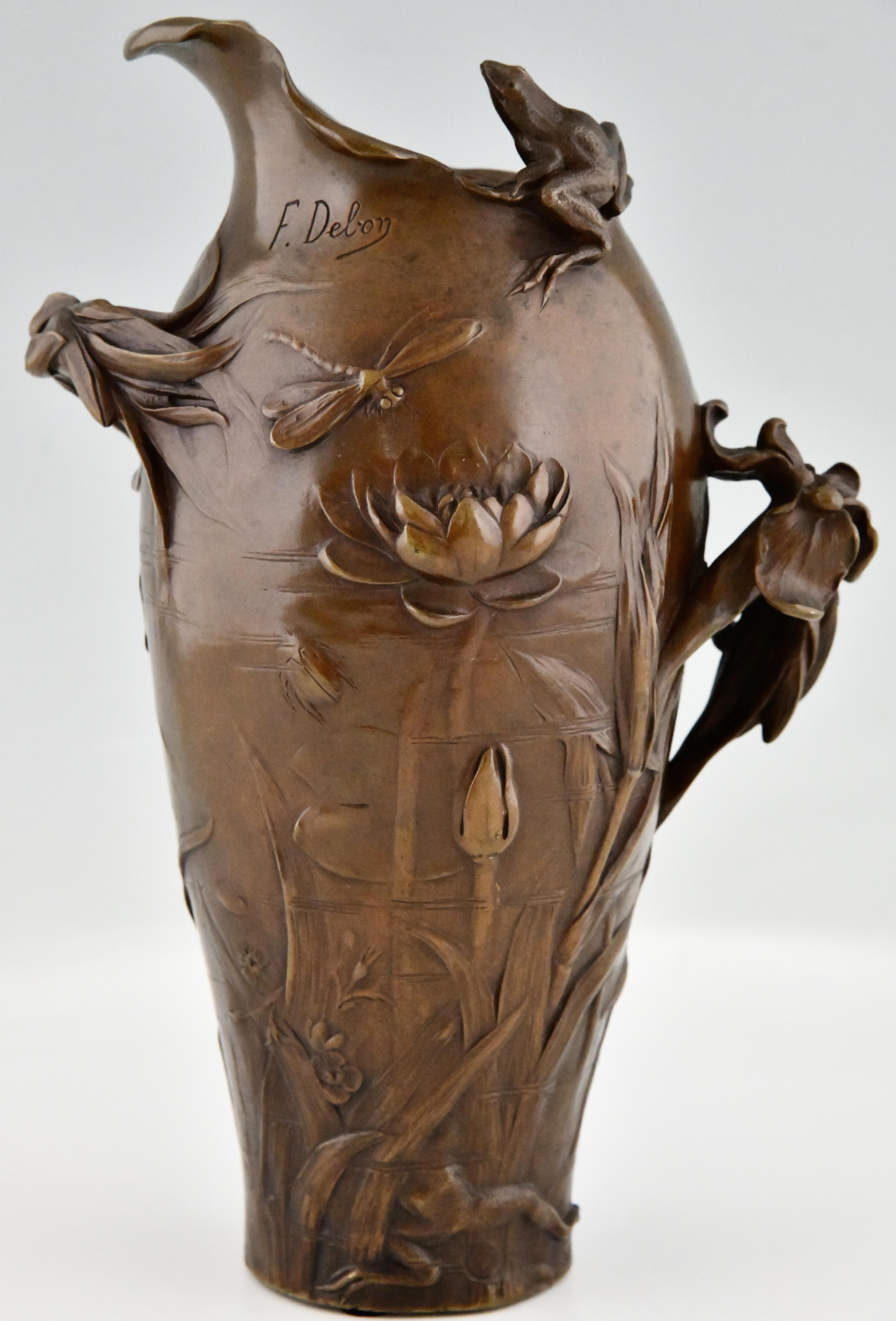 Art Nouveau bronze vase with frogs, dragonfly, water lily and iris. 
This model is called The Pond and signed by Frédéric Debon. 
France 1902. 
With Susse Frères foundry stamp and signature.
This model was exhibited at:
The salon de la Société