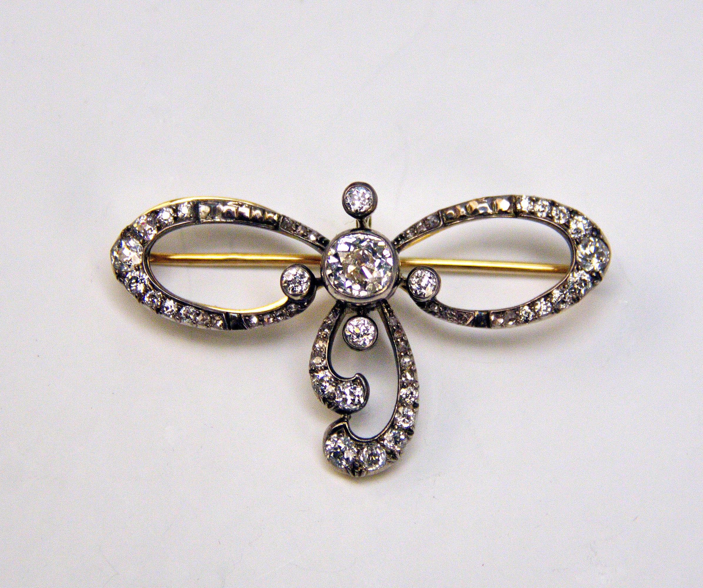 Golden Art Nouveau Brooch of most elegant appearance, manufactured as following: It is looking like a mesh/bow covered with many diamonds.
PLEASE NOTE: The brooch can be used as pendant, too, since it has a small ring at reverse side to which a