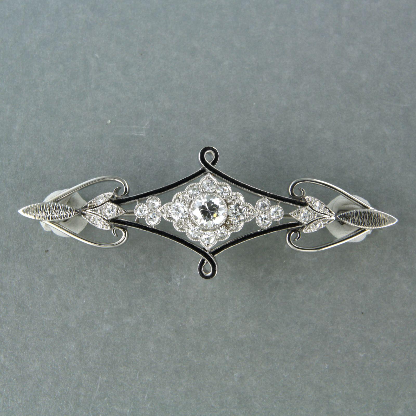 ART NOUVEAU 14k white gold brooch decorated with black enamel and set with old European cut diamonds. 1.00ct – F/G – VS/SI – 7.8 grams  

detailed description:

the size of the brooch is 5.2 cm long by 1.8 cm wide

weight 7.9 grams

set with

- 1 x