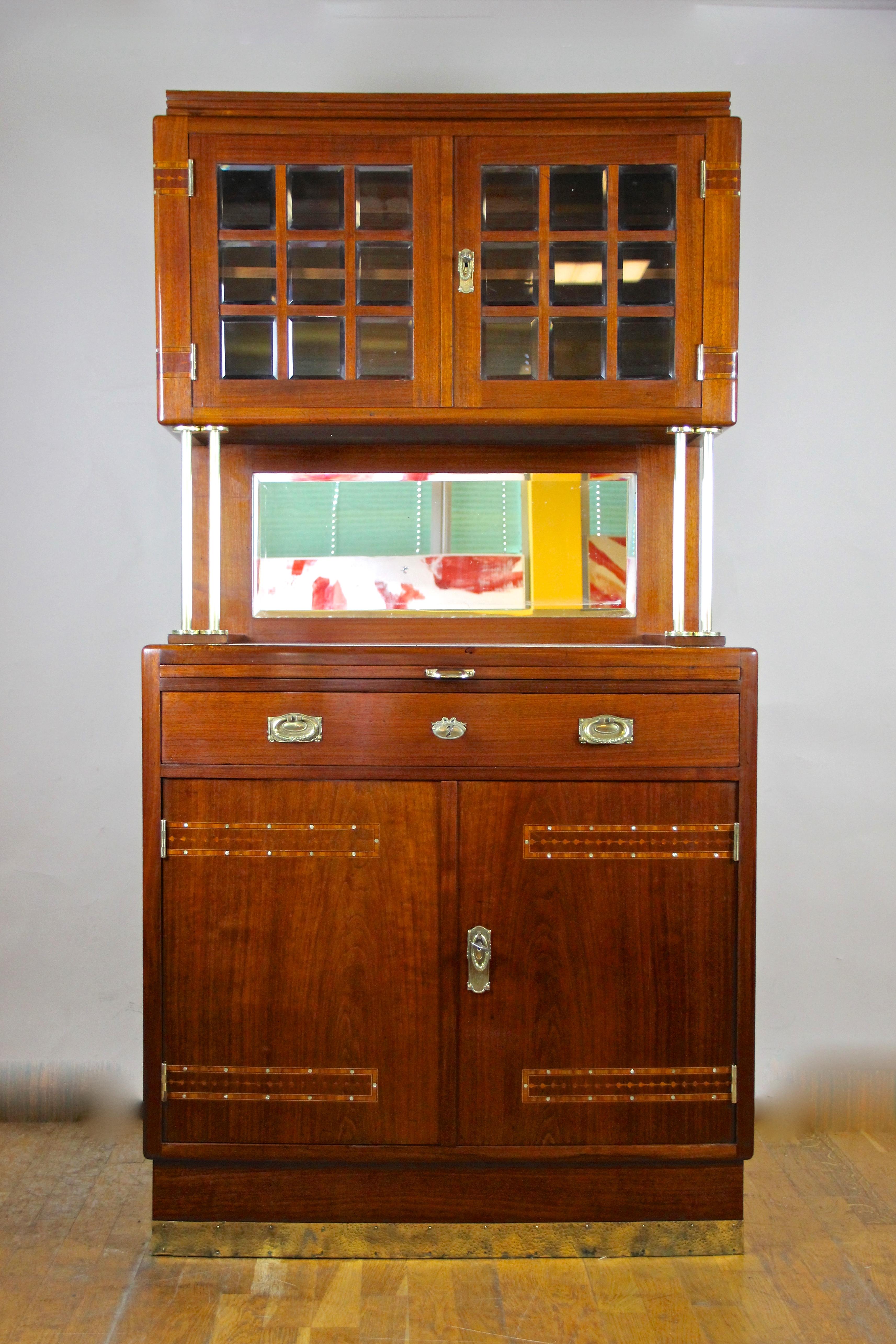 Lovely Art Nouveau buffet cabinet out of Austria made by cabinetmaker Ph. Krabina in Vienna, circa 1910. The lower part comes with a slightly convex shape providing two doors, a drawer as well as a hidden extractable writing pad. The upper part