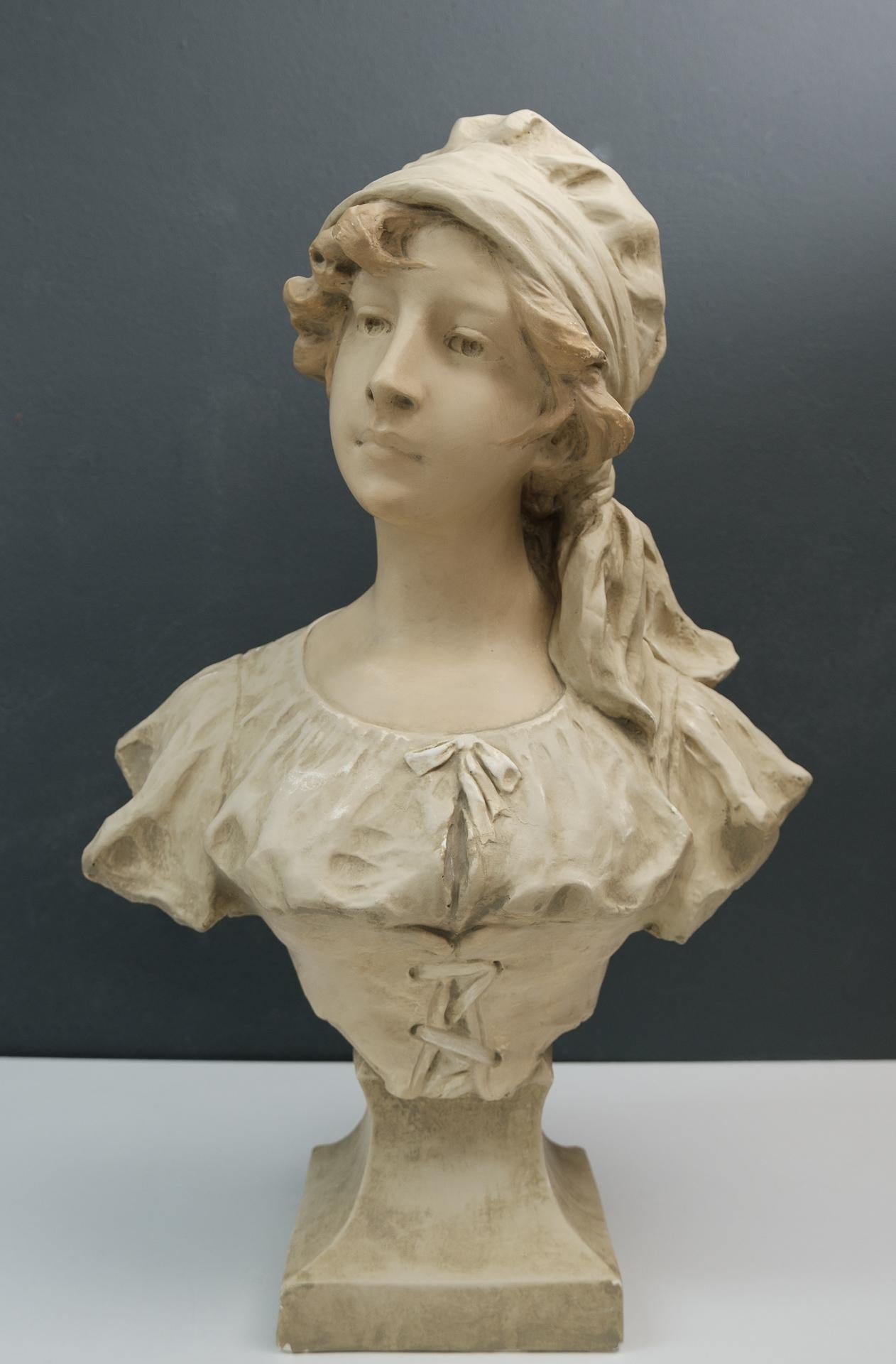 Art Nouveau bust off a young girl. France, circa 1900. Beautiful girl, looking a little
stubborn. Signed H. Laurens Plaster.