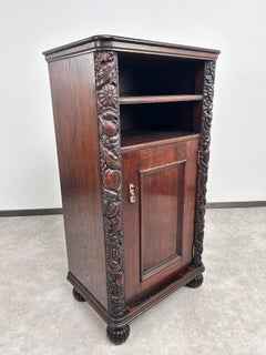 Art nouveau cabinet with a shelf with distinctive floral carvings