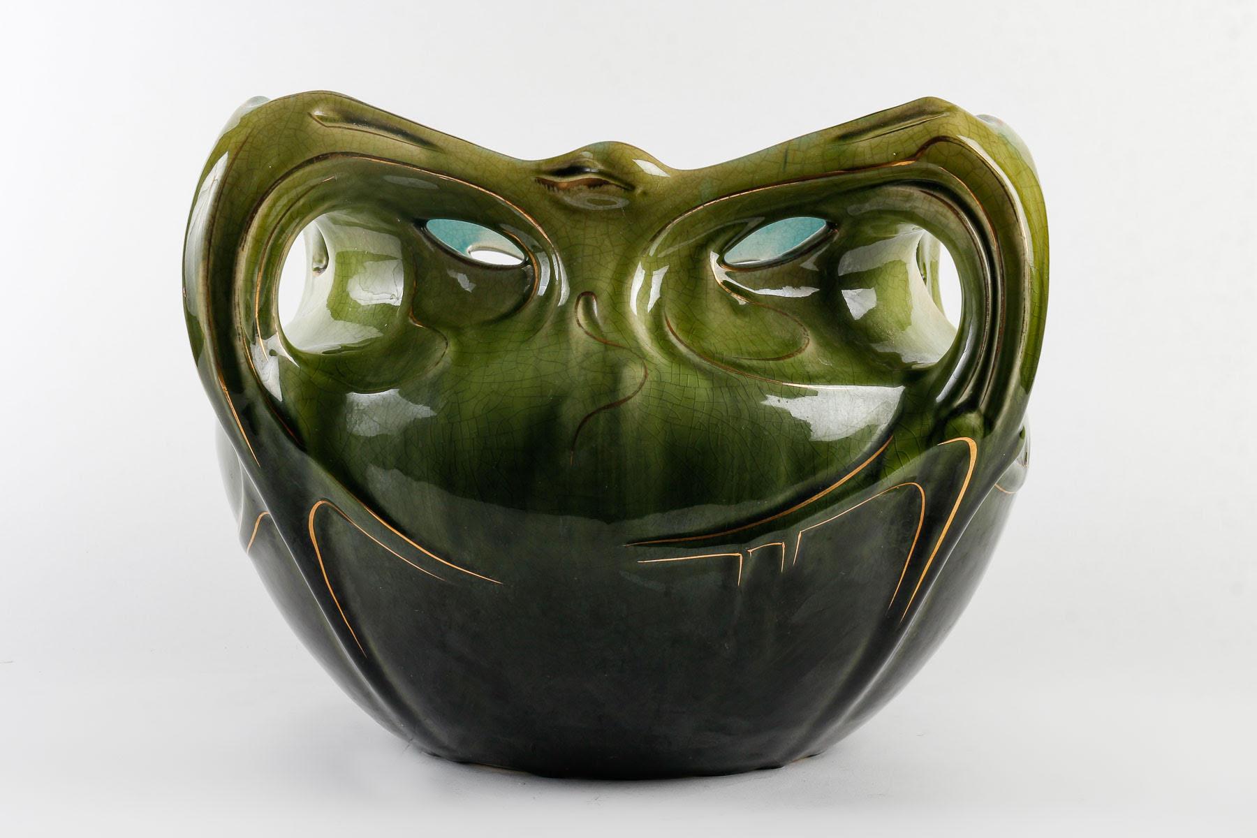 Art Nouveau cache pot, 1950-1960.

Art Nouveau style cache pot, mid 20th century, in the Guimard style in glazed ceramic.    
h: 27cm , w: 43cm, d: 25cm