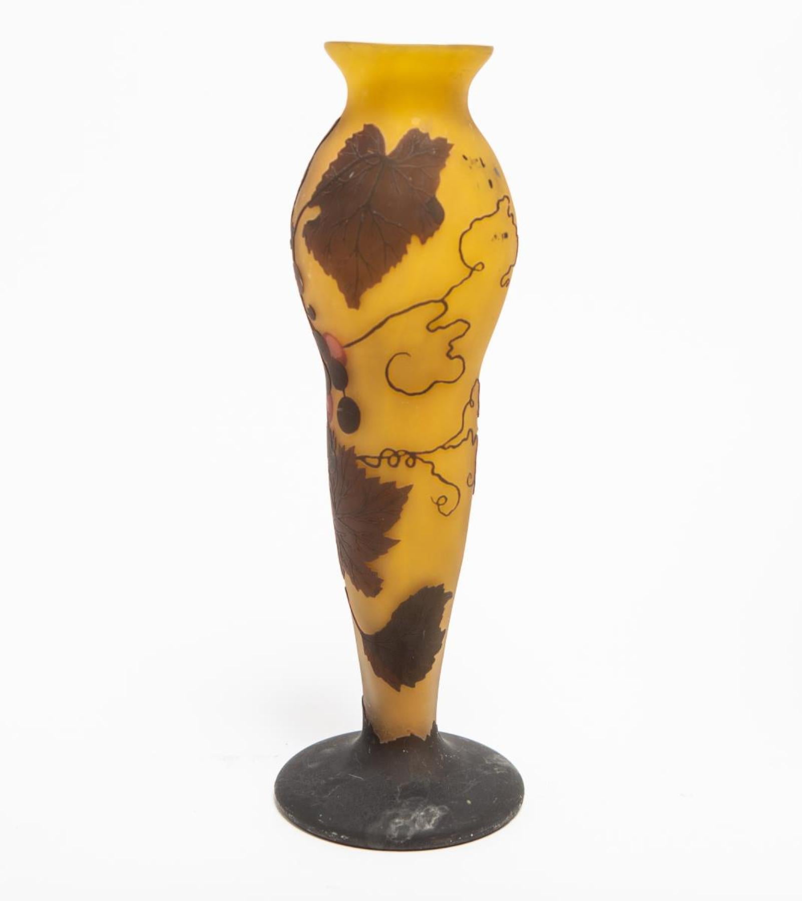 Art Nouveau cameo glass vase in the manner of Emile Galle with purple grape and leaf motifs cut into yellow ground. The piece is signed 'Ansall' in the cameo near the footing and marked 'made in Germany' on the bottom. Some age-appropriate wear.