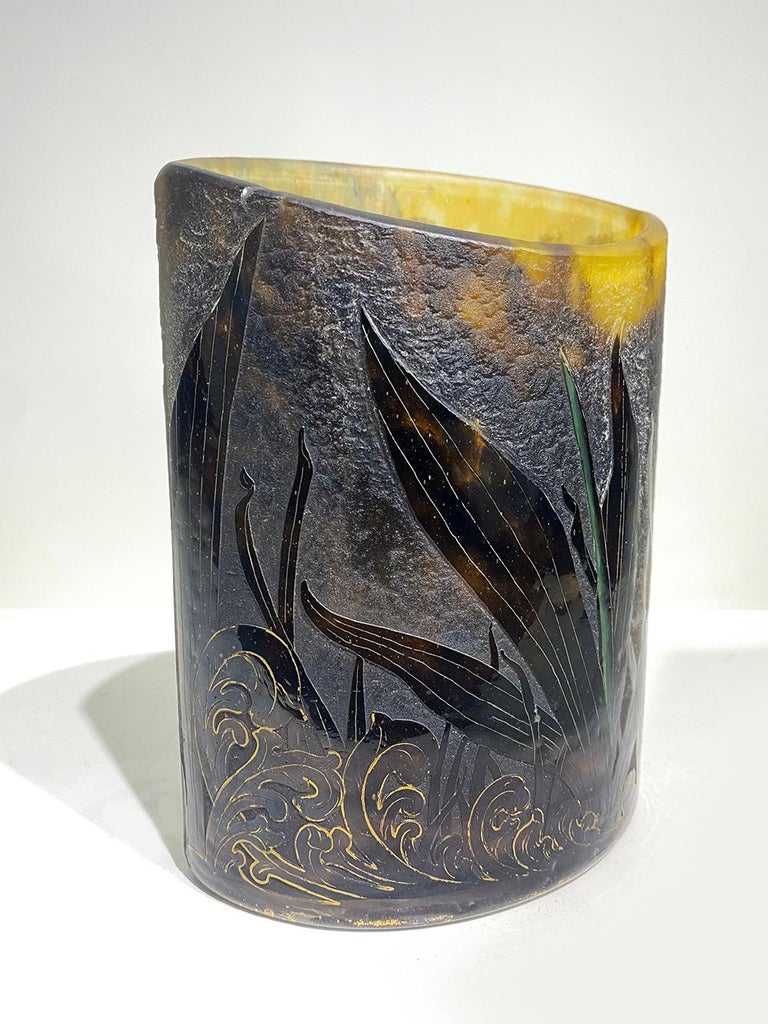This French Art Nouveau Cameo glass vase by Daum Nancy features leaves with gilded edges and spider web, having a gilded edge of the base and signed in gilt Daum Nancy with Lorraine cross, circa 1900-1910.