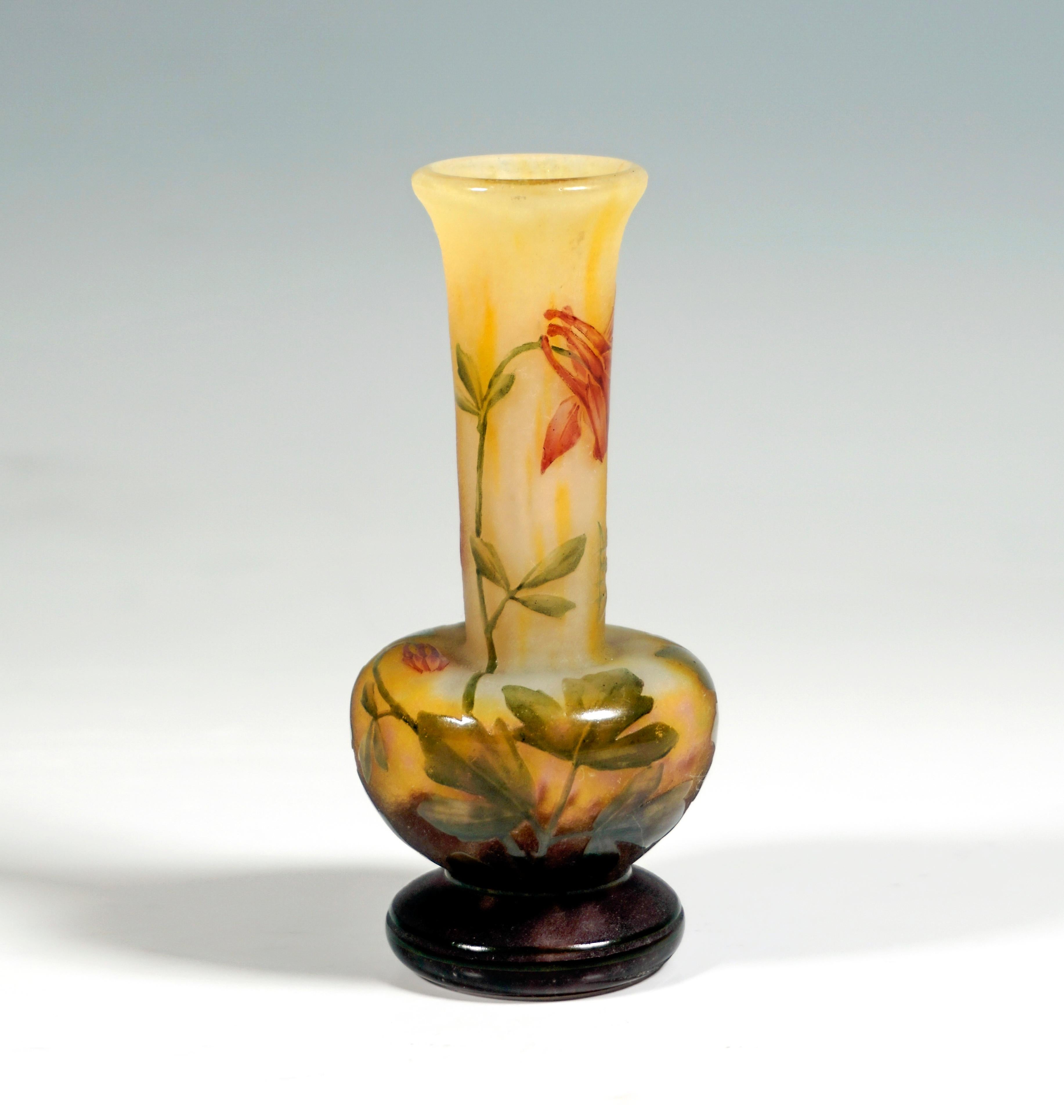 Baluster vase on a toric stepped foot, bulbous body with a long, slender, slightly widening neck with flared rim, colorless glass with white and yellow scales, in the base area with dark brown-violet powder inclusions, etched and painted in colored