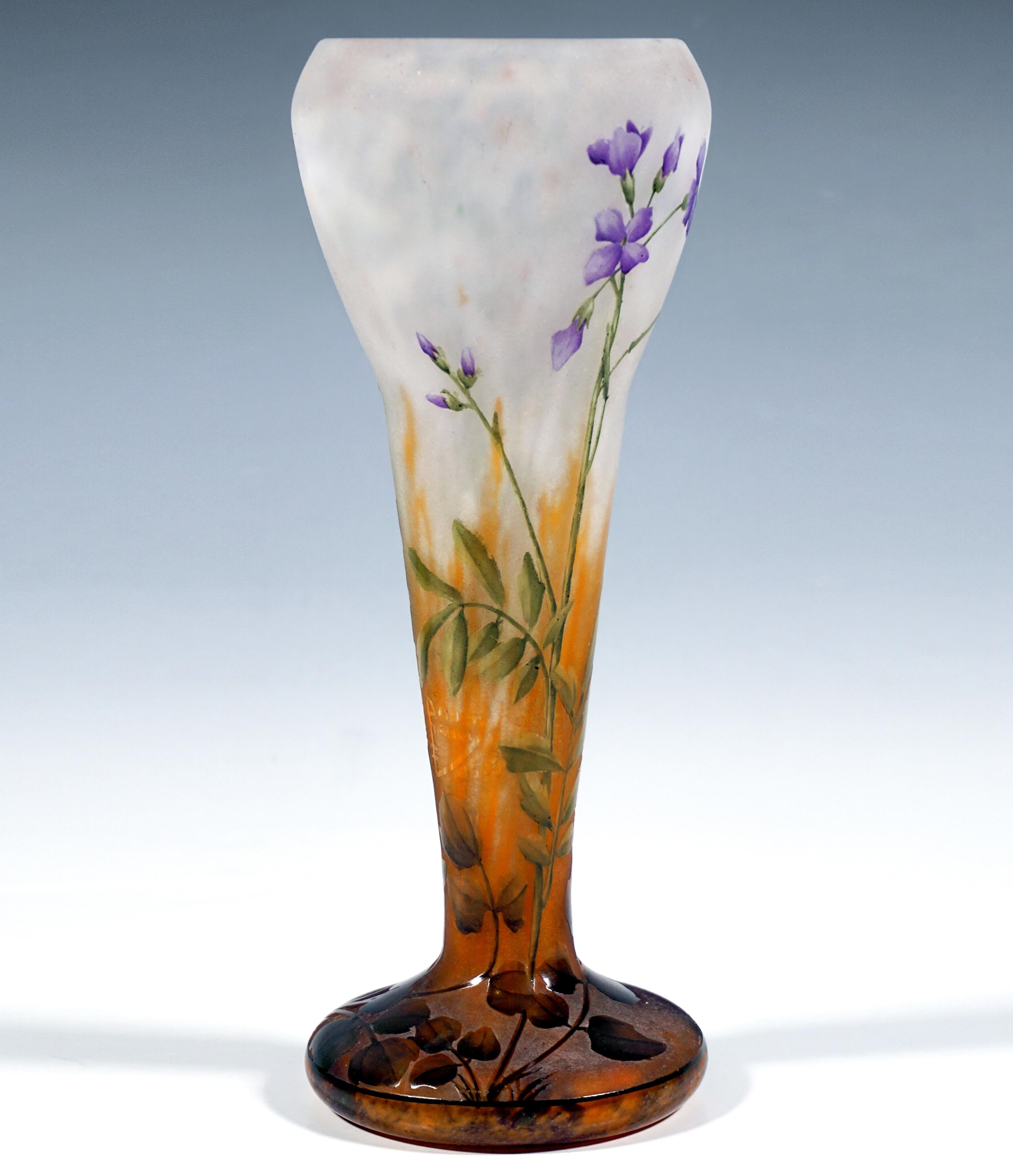 Excellent baluster-shaped vase in trumpet form on a round, offset stand, widening conically and then bulbously in the upper third, with a slightly inward-curving mouth rim, colorless glass with flaky white and yellow-orange, in the stand area with