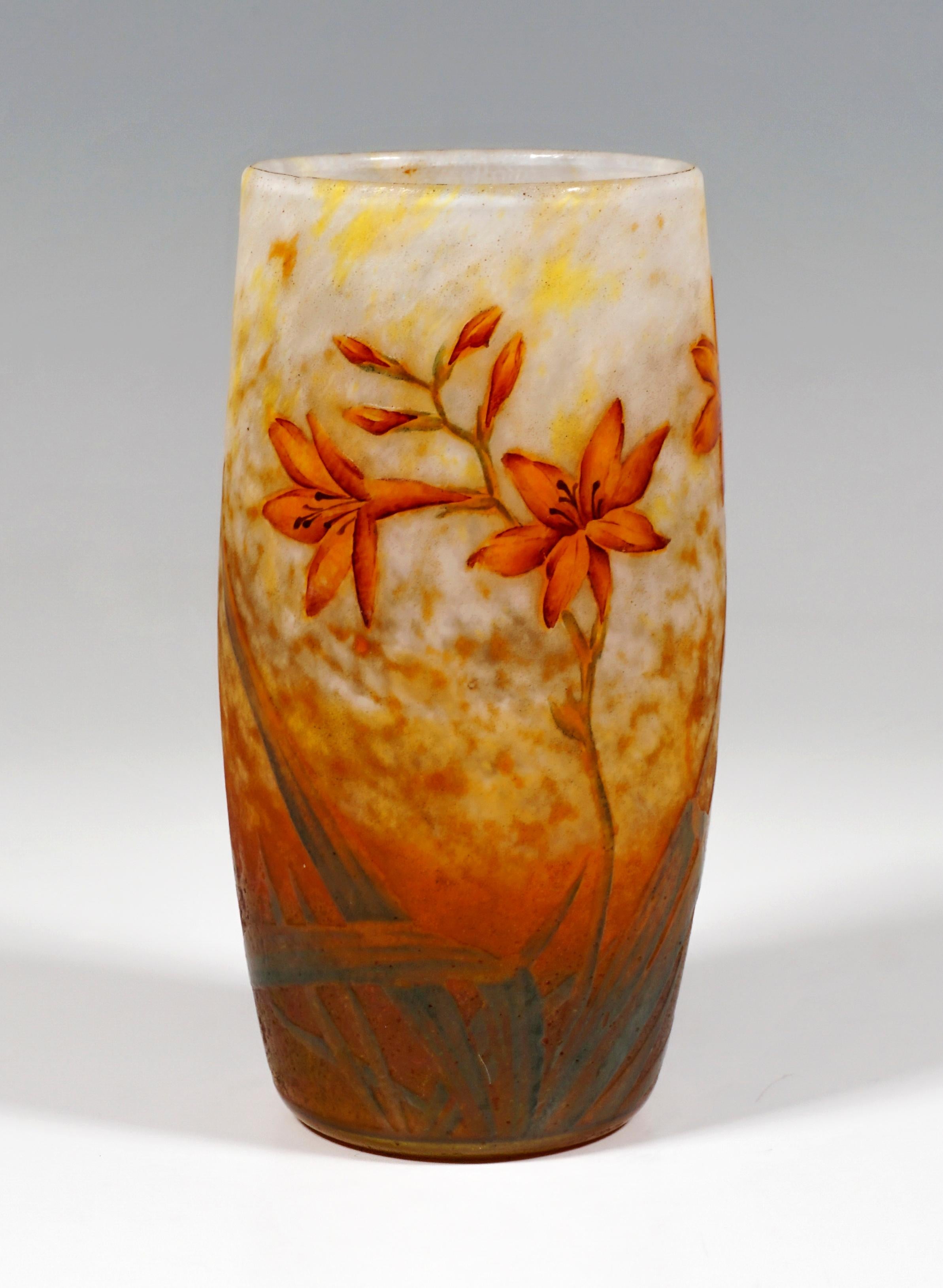 Cylindrical vase, colorless glass with flaky white and yellow, in the stand area with rust-brown and green powder melts, with etched daylily decoration painted in colored enamel, satined, structured surface in the background, relief signature 'DAUM