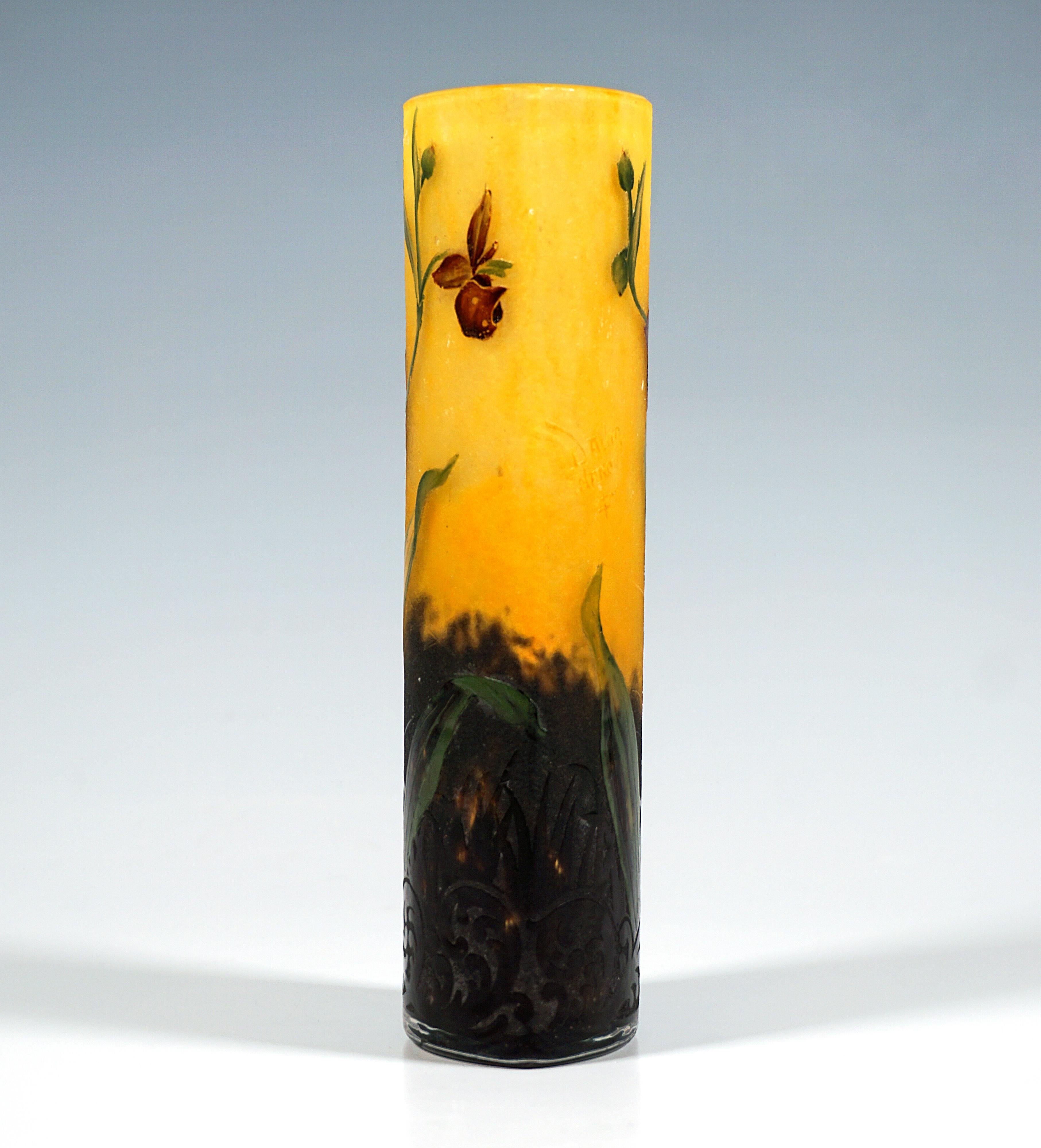 Vase on an almond-shaped base with straight vertical walls, colourless glass with flaky yellow and reddish-orange powder meltings above, in the lower area with brown-violet powder meltings, with a highly etched decor with a cameo of a lady's slipper