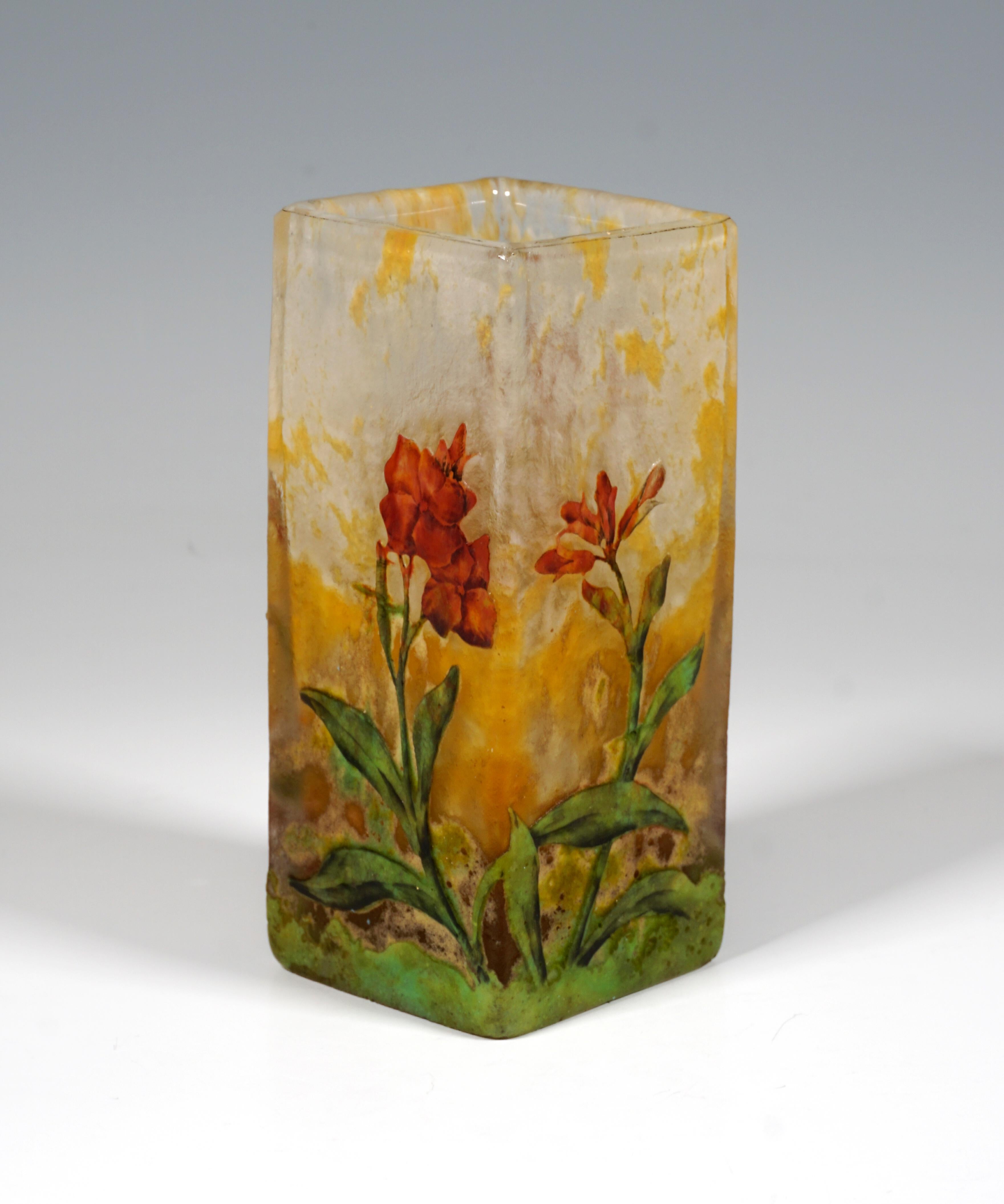 Angular vase on a square floor plan, colorless glass with flaky white and yellow, in the stand area with light green powder melts, with etched and painted red blooming meadow flowers decor in colored enamel, satined and structured surface in the