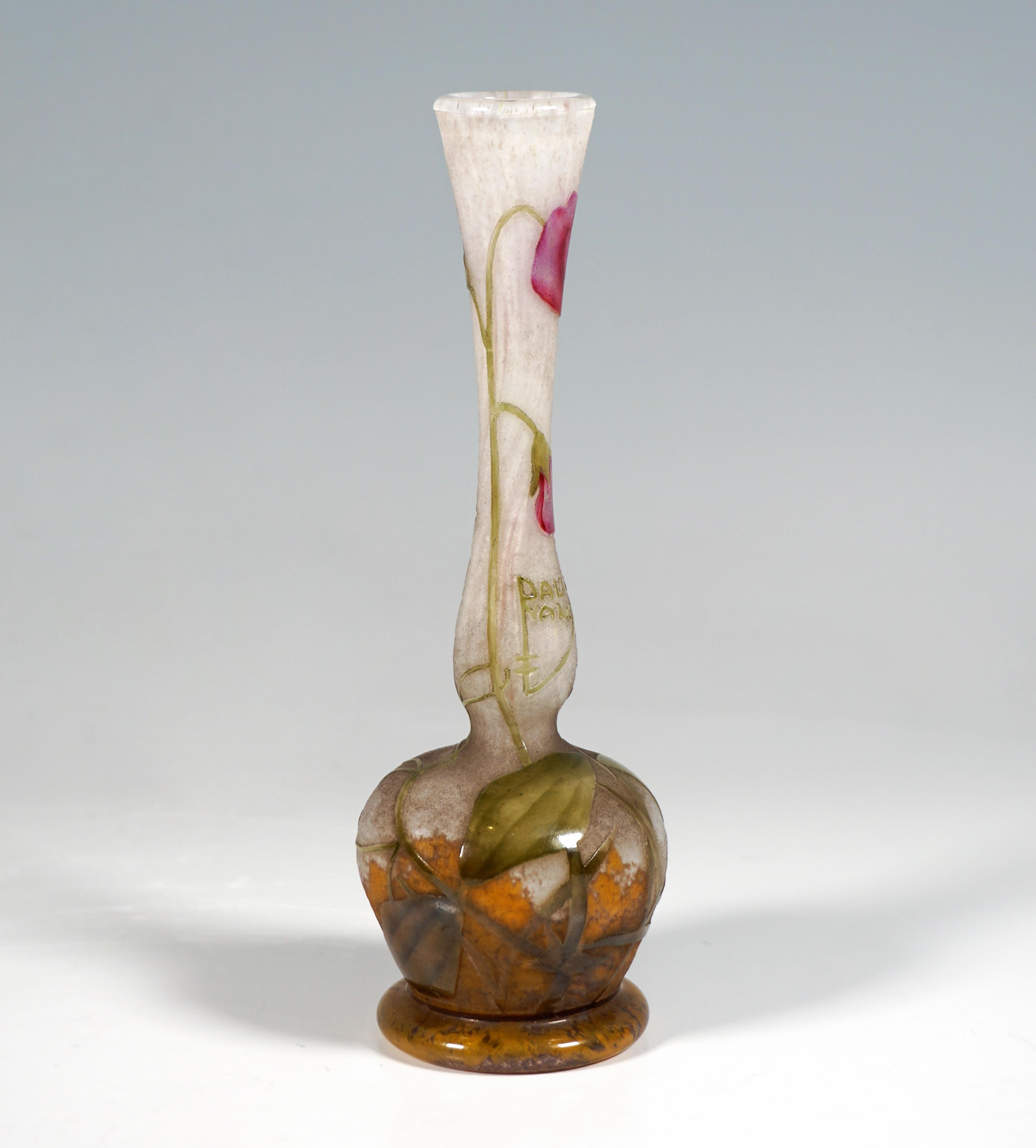 Delicate baluster vase with a bulbous body on a round base ring with a slender, long, curved and slightly widening neck, colorless glass with flaky white and grayish powder inclusions, in the base area with yellow-orange-brownish color powder