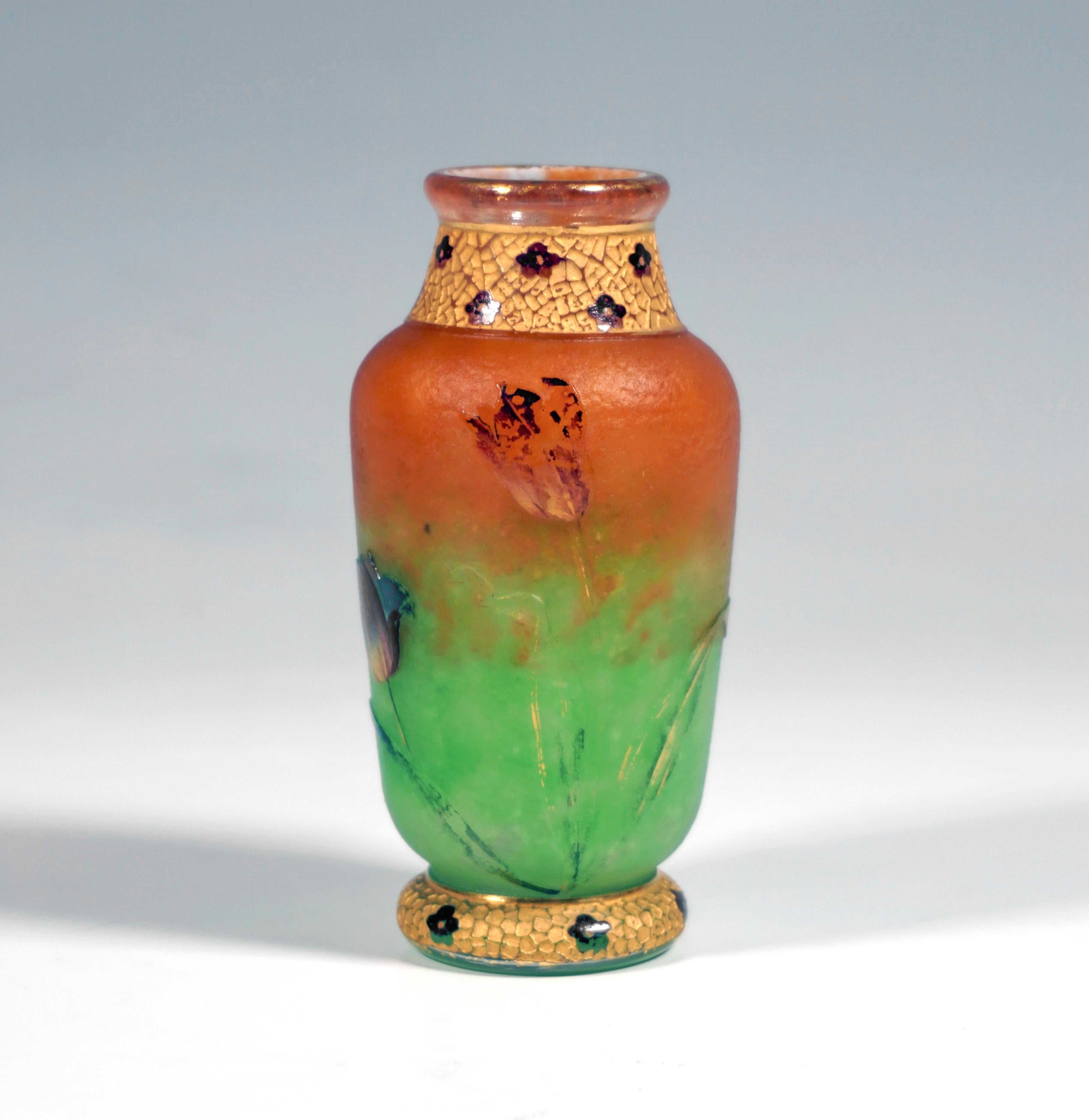 Baluster vase on a stepped base ring, bulbous body with a short neck and flared mouth rim, colorless glass with flaky green powder inclusions in the lower area and rusty brown in the upper area, with etched tulip decoration painted in colored enamel