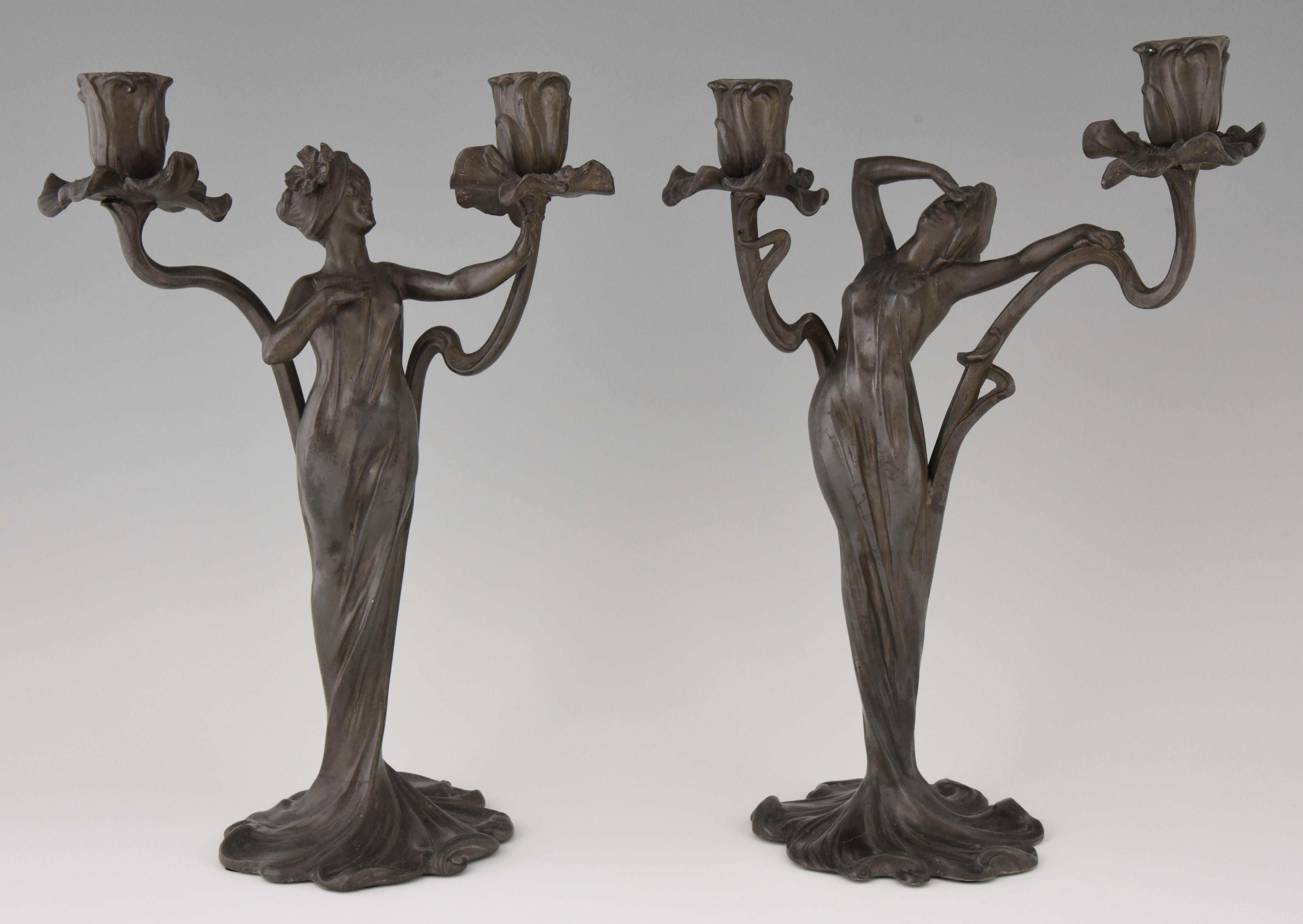 Elegant pair of Art Nouveau pewter candelabra decorated with ladies and flowers by the French artist Claude Bonnefond, France, 1900.
Weight: 3.3 kg.