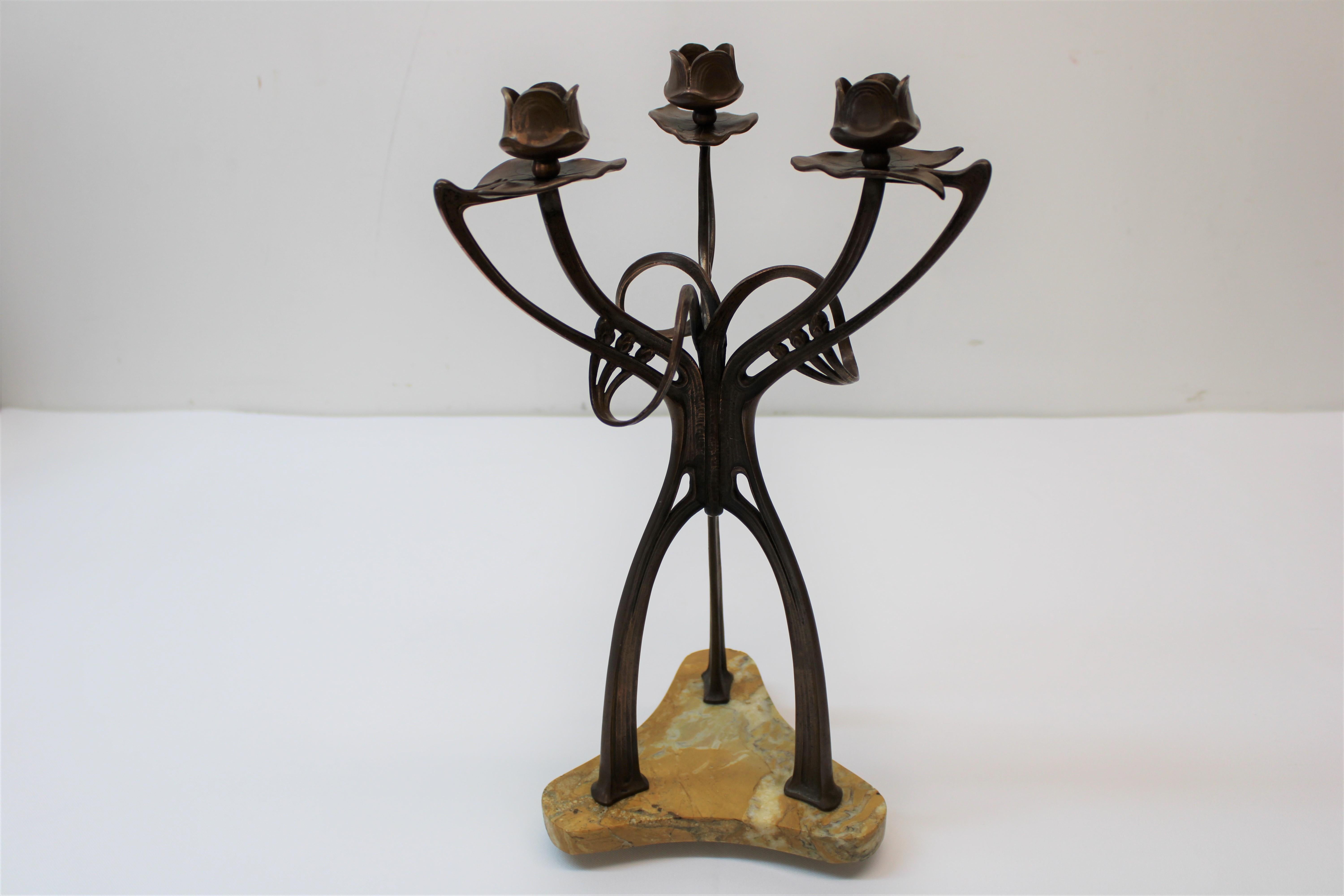 C. 1915 stunning 3 branch bronze Art Nouveau candle holders w/ marble bases are what homes are made of.
These floral looking tops that the candles sit in are adorable, with very sturdy bases let your candles set the mood in any room.