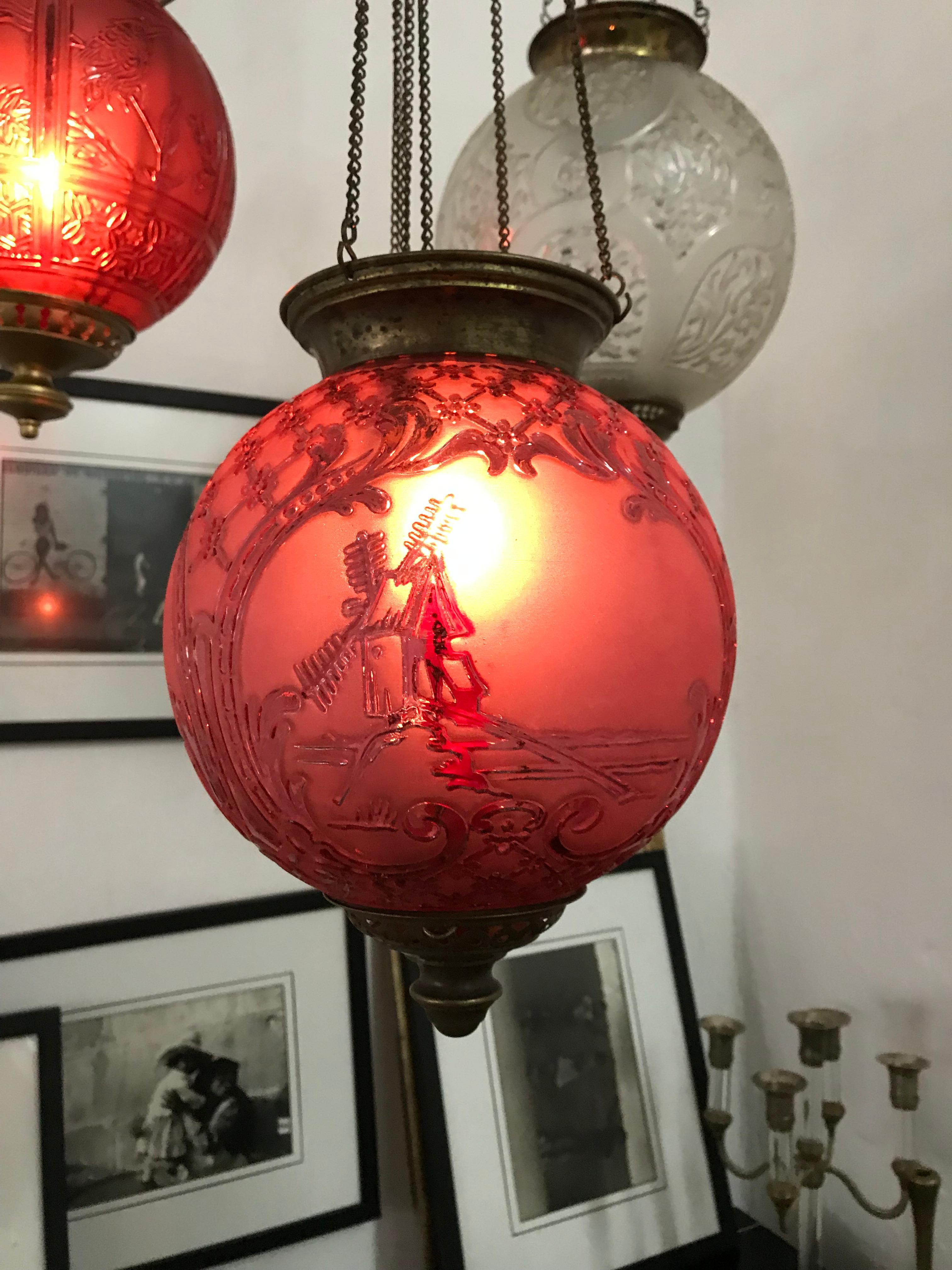 Late 19th or early 20th century ruby red glass Lantern by Baccarat France, unsigned but a well documented model.
It has 3 panels depicting a Windmill, a farmhouse and a Greek temple.
At the moment it can hold a candle (we recommend using Battery