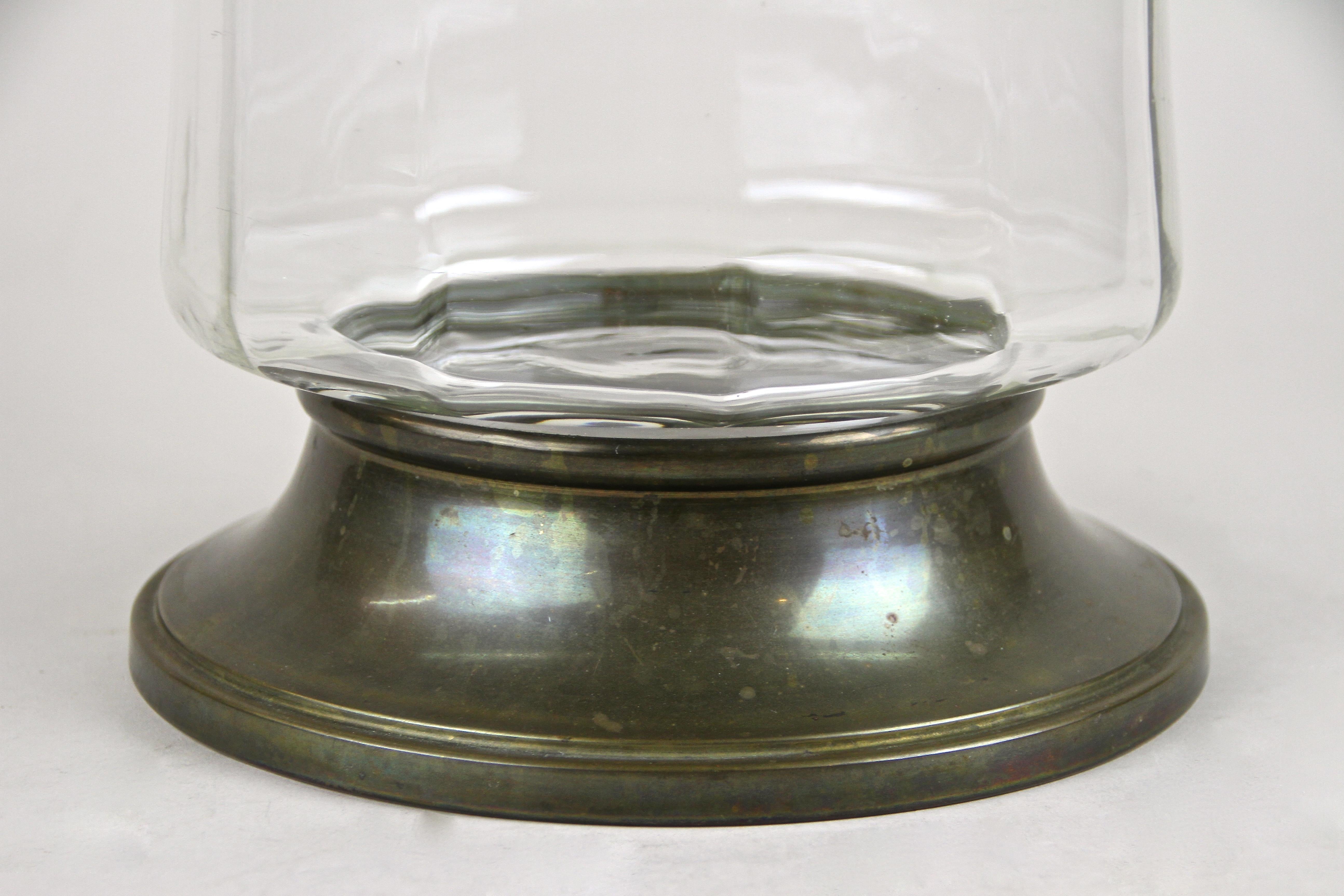 Lovely Art Nouveau candy glass jar from the early period in Vienna, circa 1910. This early 20th century large Austrian glass box was part of an old Austrian candy shop and impresses with an artfully shaped, slightly twisted glass body embedded into