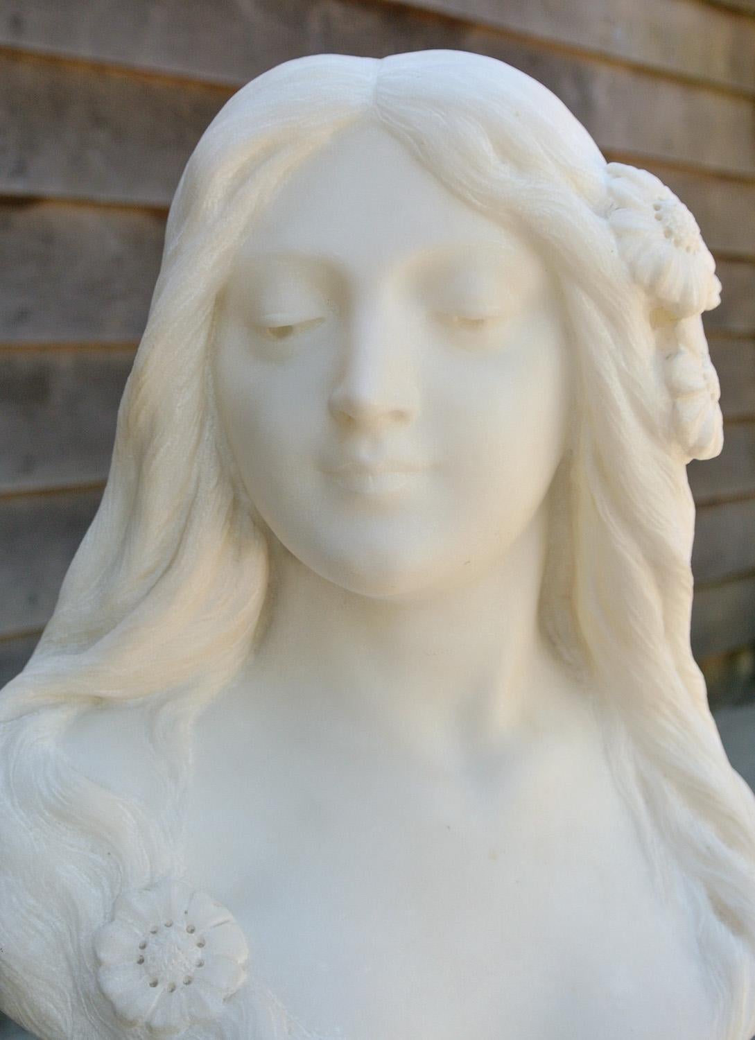 Follower of Emilio Fiaschi (1858 - 1940) a finely carved large alabaster bust of a beautiful young woman with flowing hair woven with daisies.

Art Nouveau period circa 1890, this graceful, beautiful and enigmatic young woman has been modelled in
