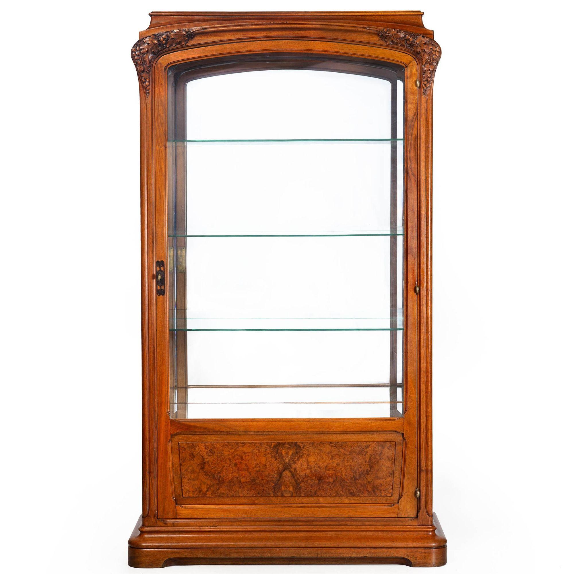 ART NOUVEAU CARVED AND BURL WALNUT DISPLAY CABINET
Circa early 20th century  unmarked  of very fine quality
Item # 410YOI09P

An incredibly beautiful statement piece, this Art Nouveau display cabinet features a loosely organic form with fully