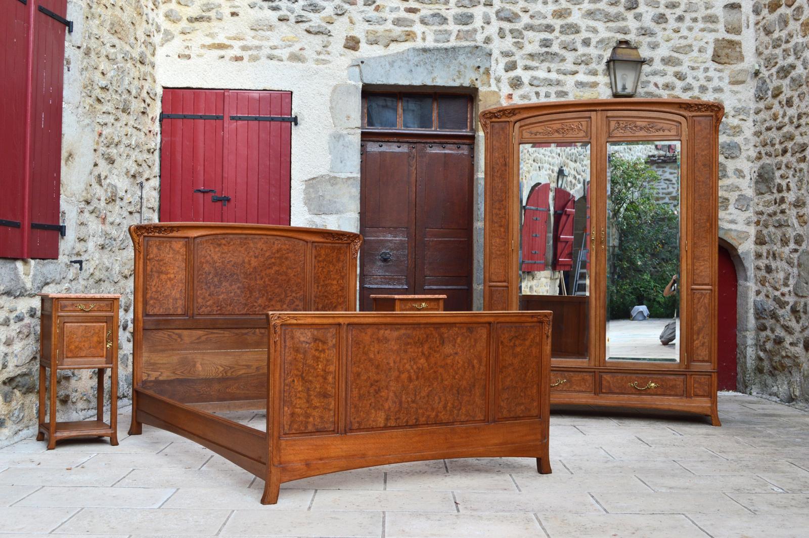 Superb set composed of four elements: 1 large wardrobe, 1 bed, 2 bedside tables / nightstands.

French Art Nouveau, Ecole de Nancy, circa 1905, attributed to Louis Majorelle.

Beautiful quality of manufacture, the four pieces of furniture are in