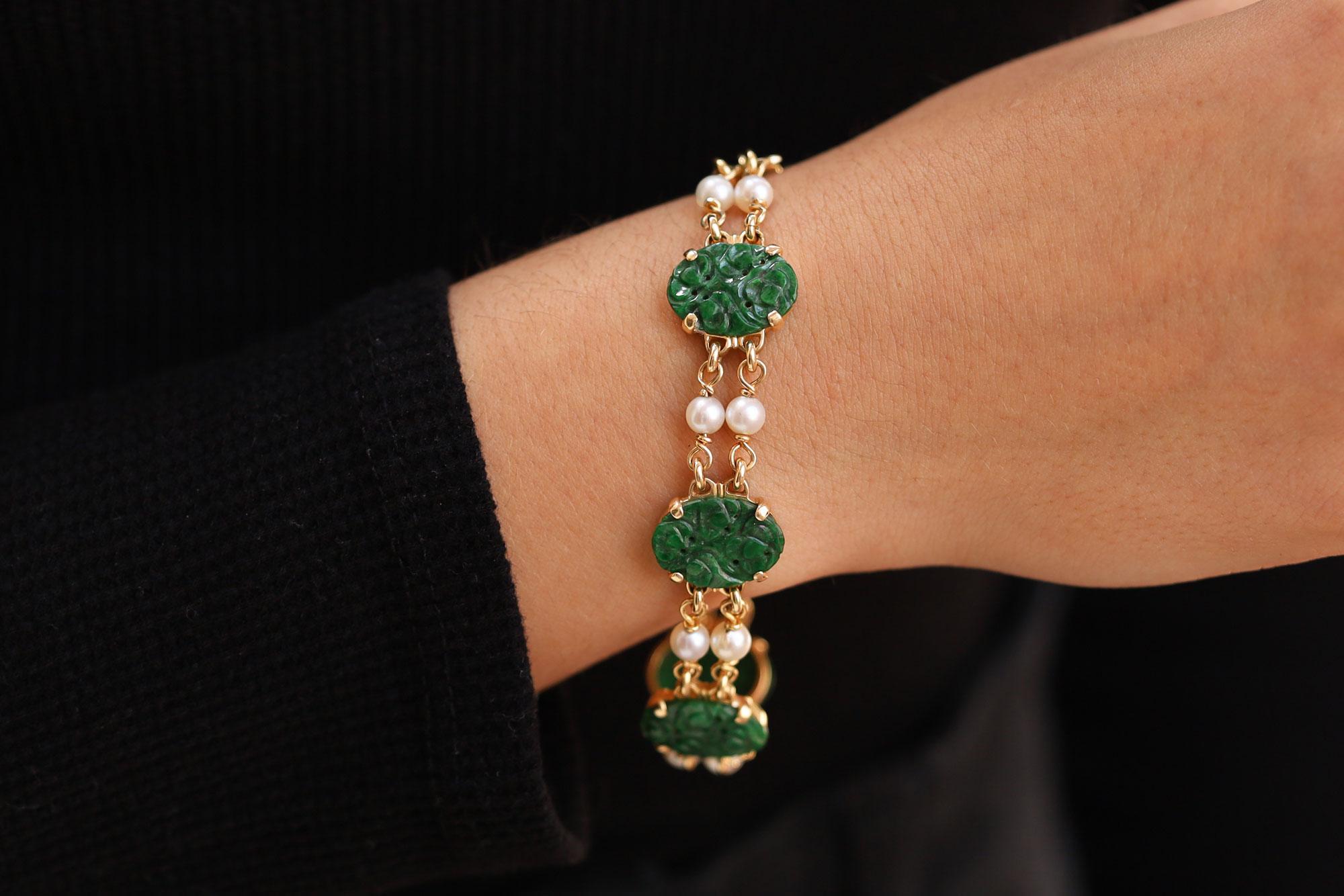 The natural, untreated, Type A jadeite in this delightful station bracelet boasts a vibrant, mottled green color in the undulating oval carved plaques. The unmistakable beauty of the Art Nouveau era is exemplified in this antique bracelet,