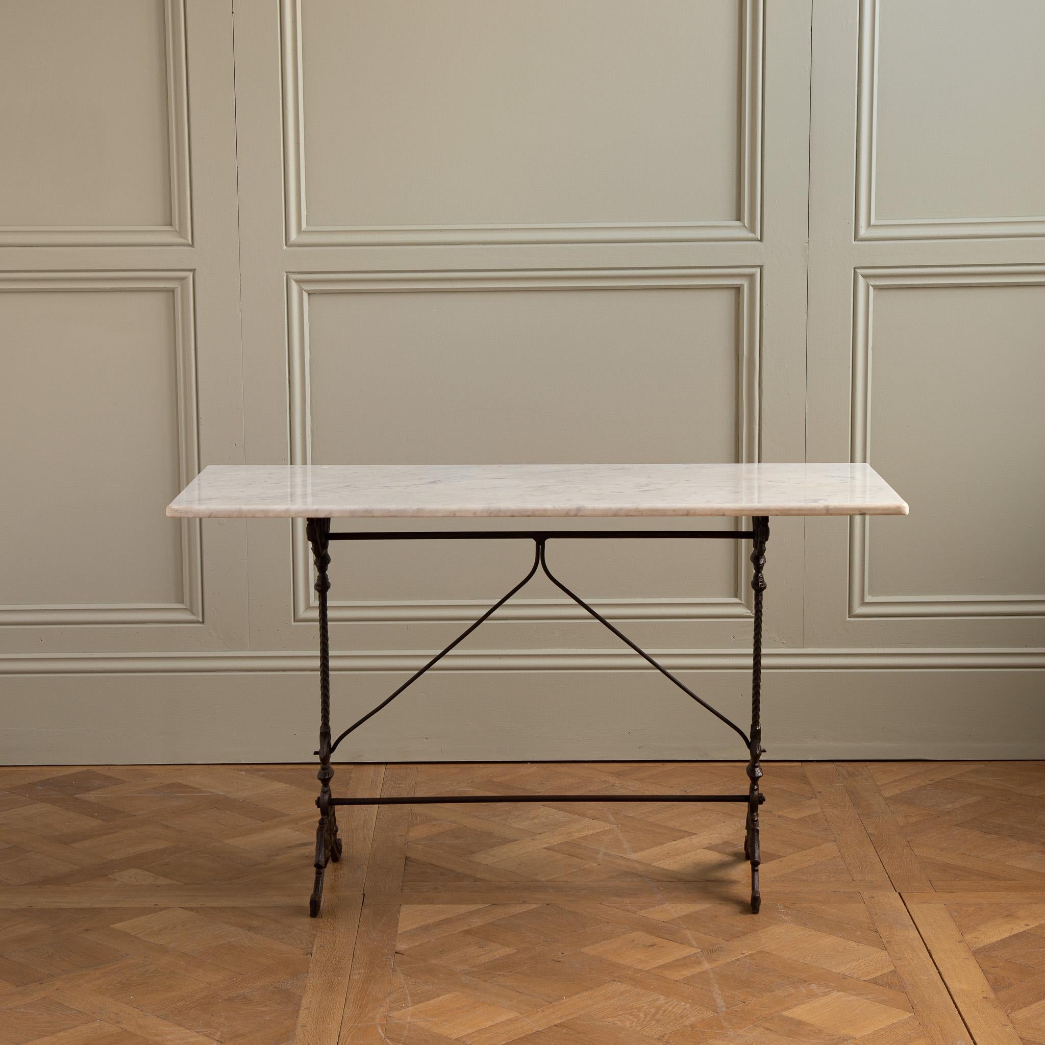 Cast iron Bistro table from the Art nouveau period with a Carrara marble top.
 
