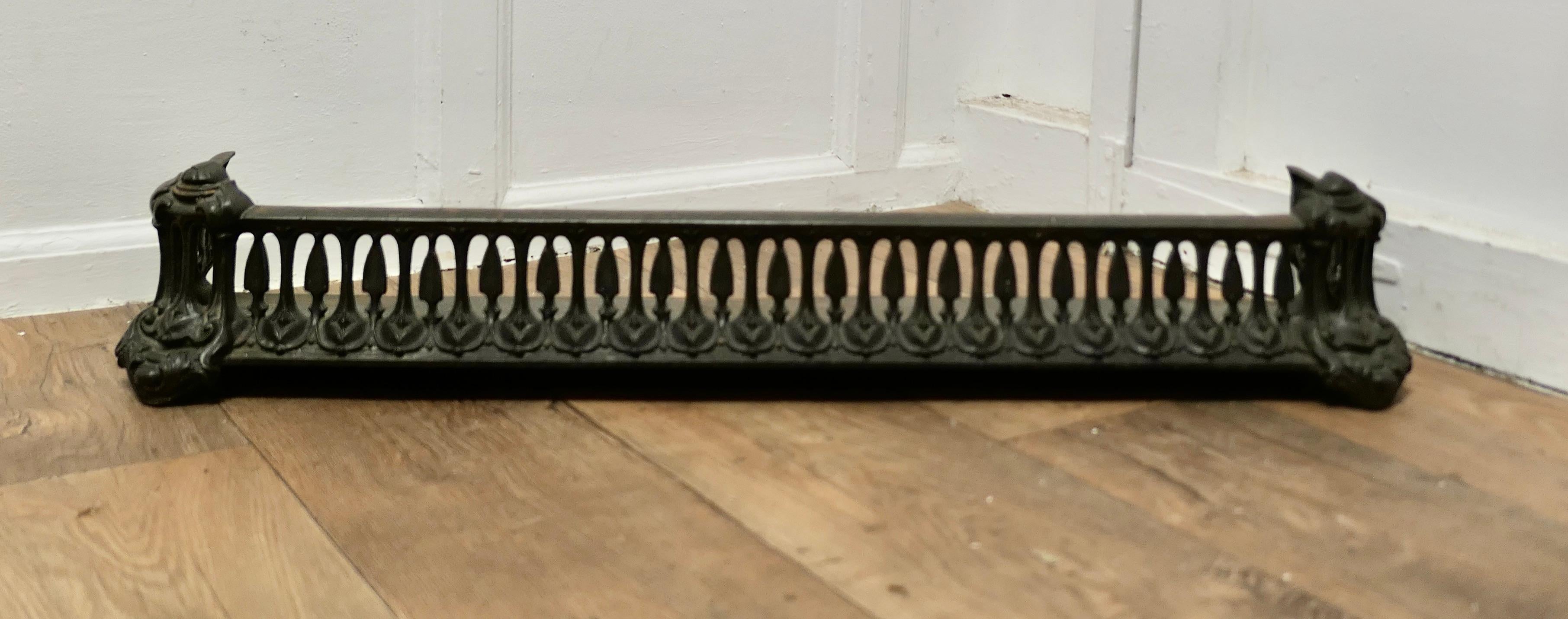 Art Nouveau Cast Iron Colebrookdale Style Fender or Dog Grate

This is a Good Victorian Fender it is good and heavy, fenders like this were known as Dog Grates as they serve to rest the fire tools and keep any rolling ash in check
The Fender is in