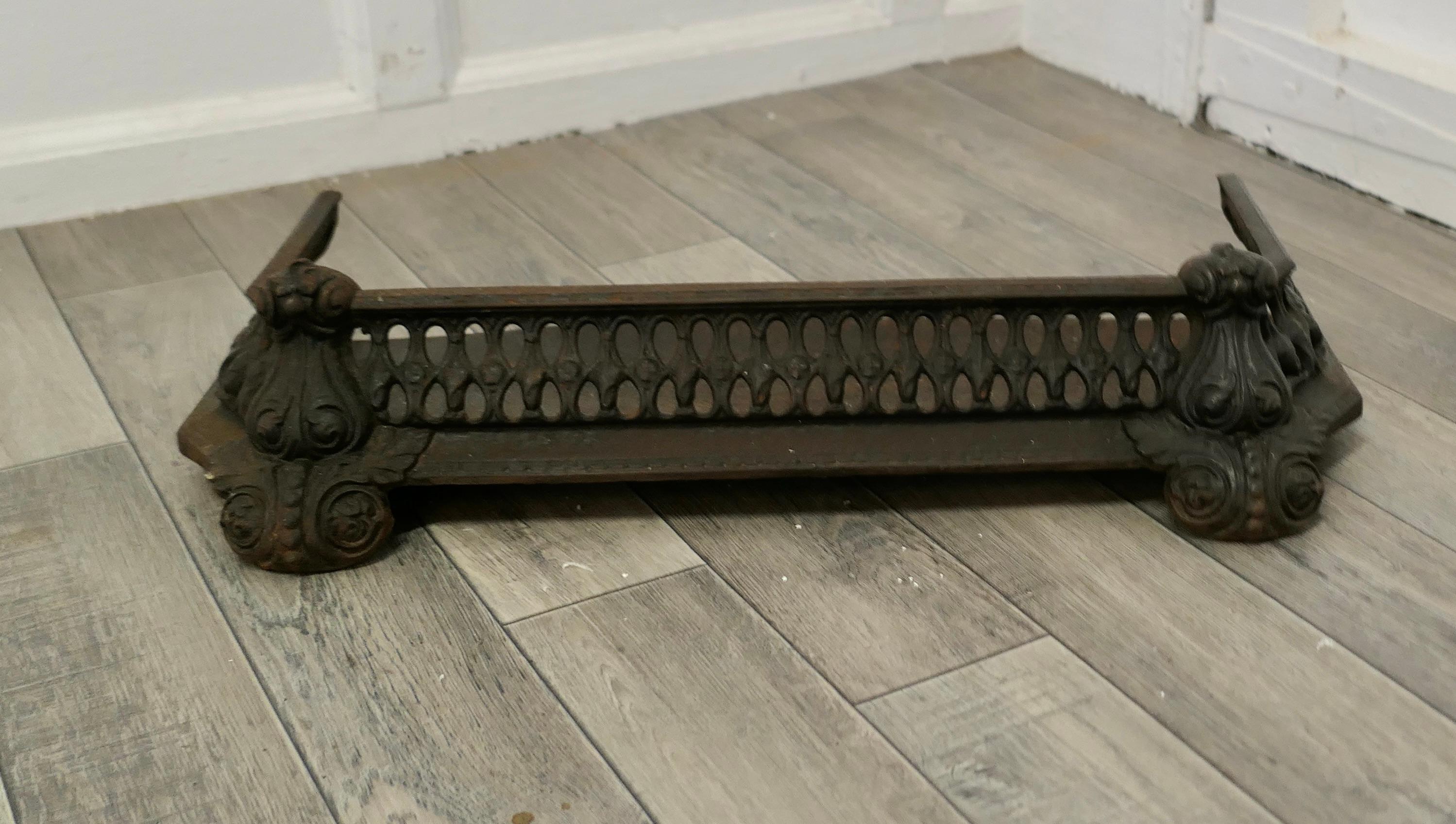 Art Nouveau Cast Iron Fender or Dog Grate

This is a Good Victorian Fender it is good and heavy, fenders like this were known as Dog Grates as they serve to rest the fire tools and keep any rolling ash in check
The Fender is in good sound condition