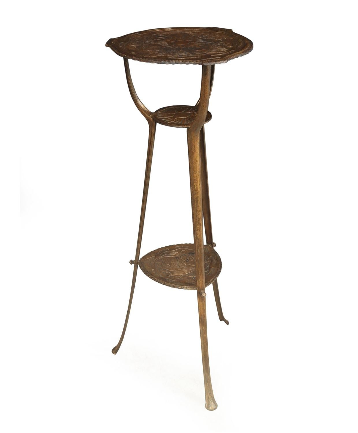 Art Nouveau cast iron jardinière stand

A cast and patinated plant stand produce around the turn of the 19th-20th century with decorative pressed tops, each section is marked with the same number 6452 including the large top but this also has the