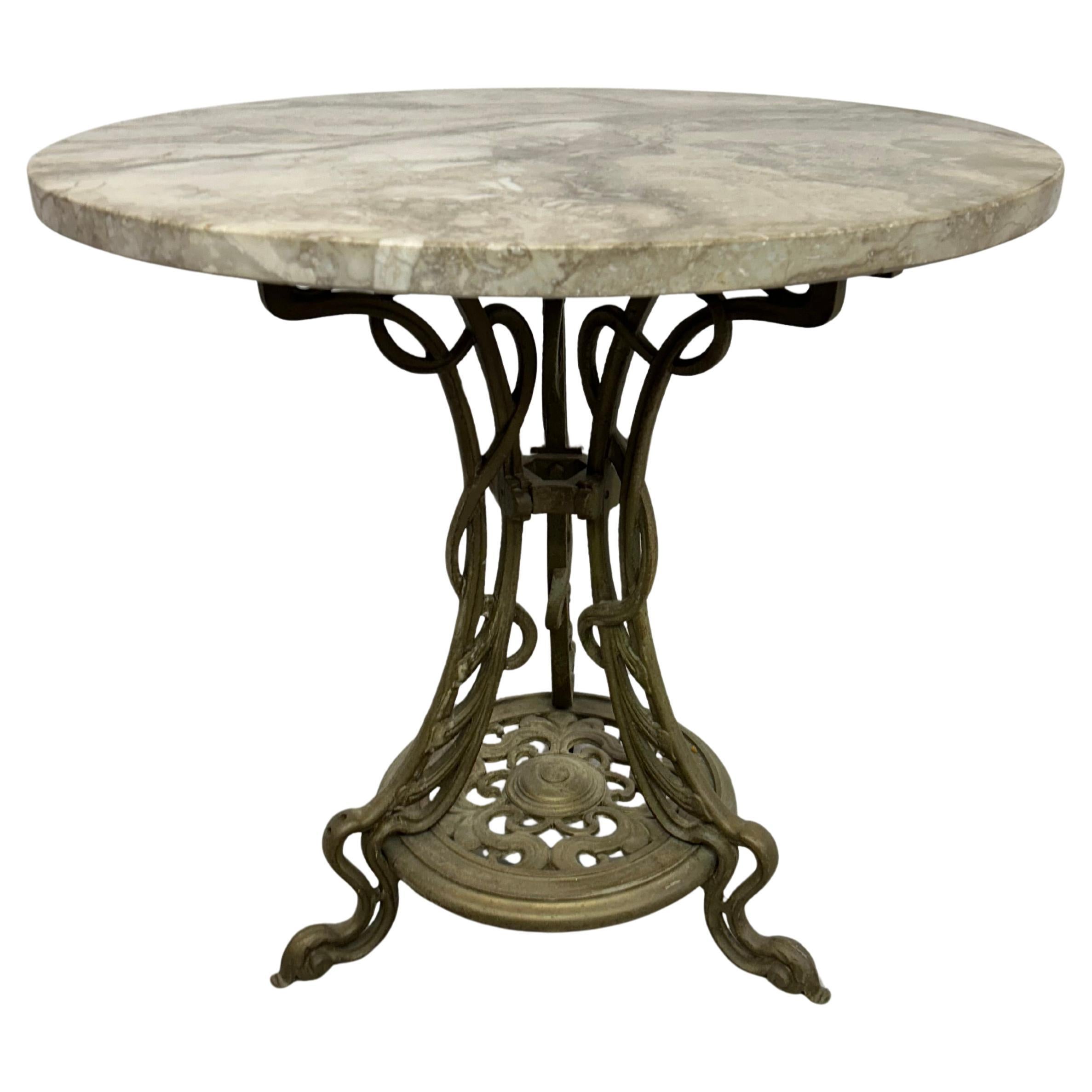 Art nouveau cast iron table with marble top For Sale