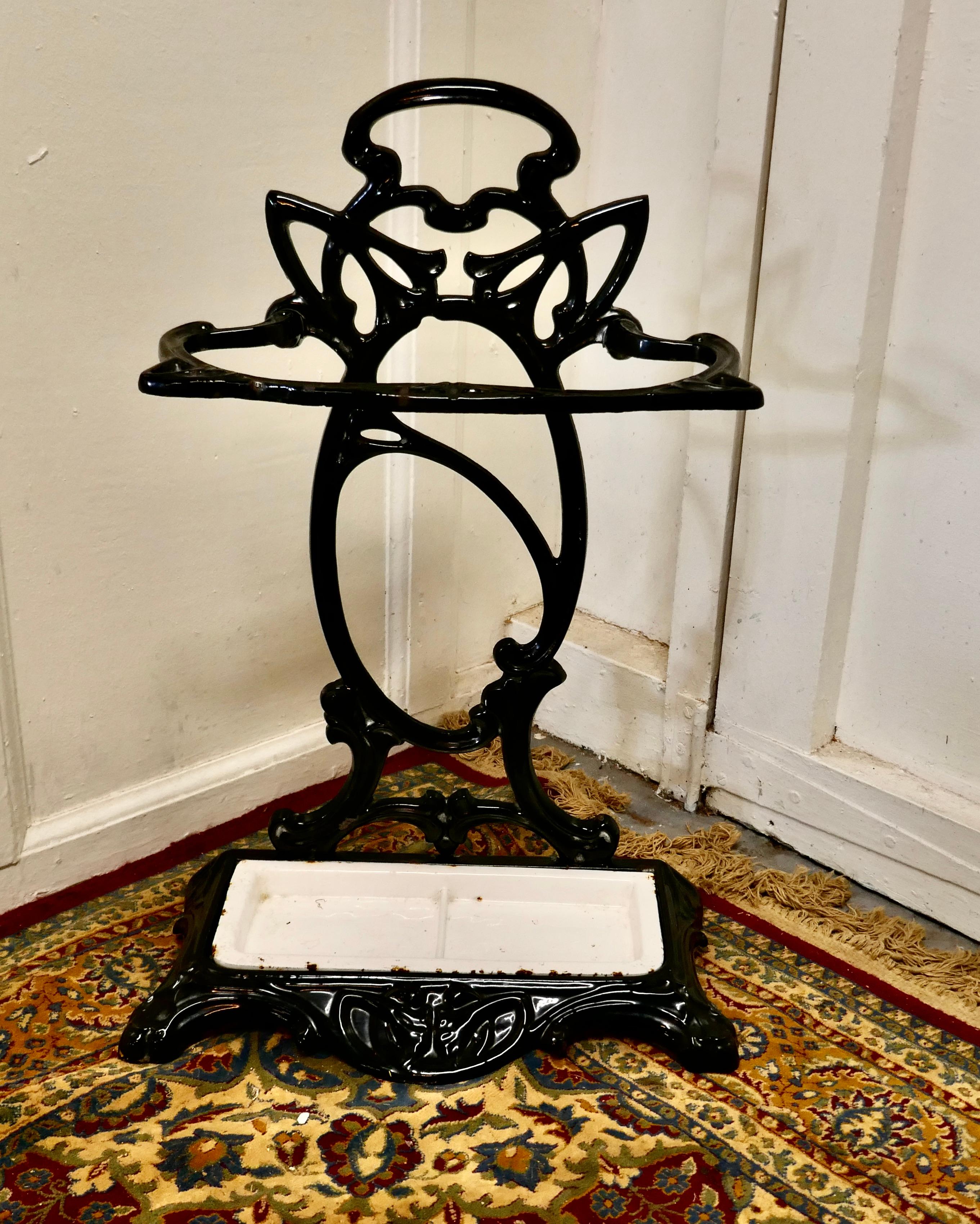 Art Nouveau cast iron umbrella and stick stand

A very attractive Art Nouveau cast iron hall stand with a removable enamel drip tray
This impressive little cast iron hall stand is in great condition it has a painted finish which is very slightly