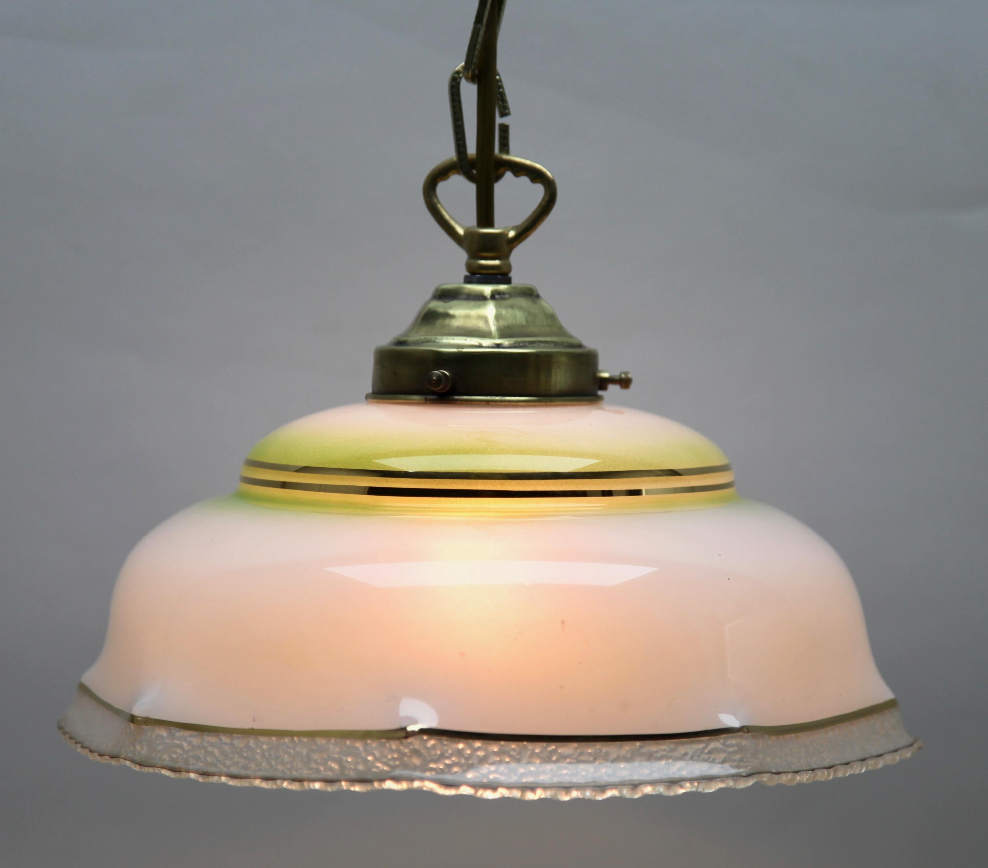 Art Nouveau ceiling lamp

Photography fails to capture the simple elegant illumination provided by this lamp.

Fitting messing pendant ceiling light with screw fixing to hold a stylish Belgian Art Deco lampshade. 
Good distribution of darker and