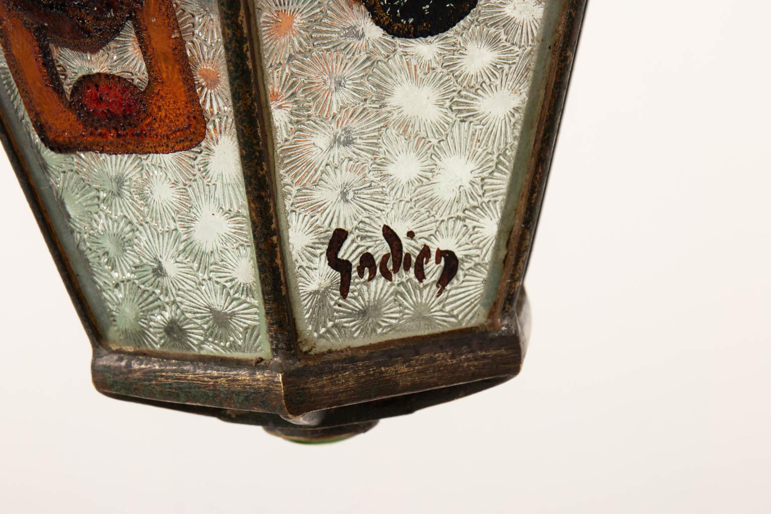 Cast bronze Art Nouveau ceiling light by Adrien Godien, circa 1890-1949. The piece is completely glazed and features six side panels of hand painted, patterned glass with one signed 
