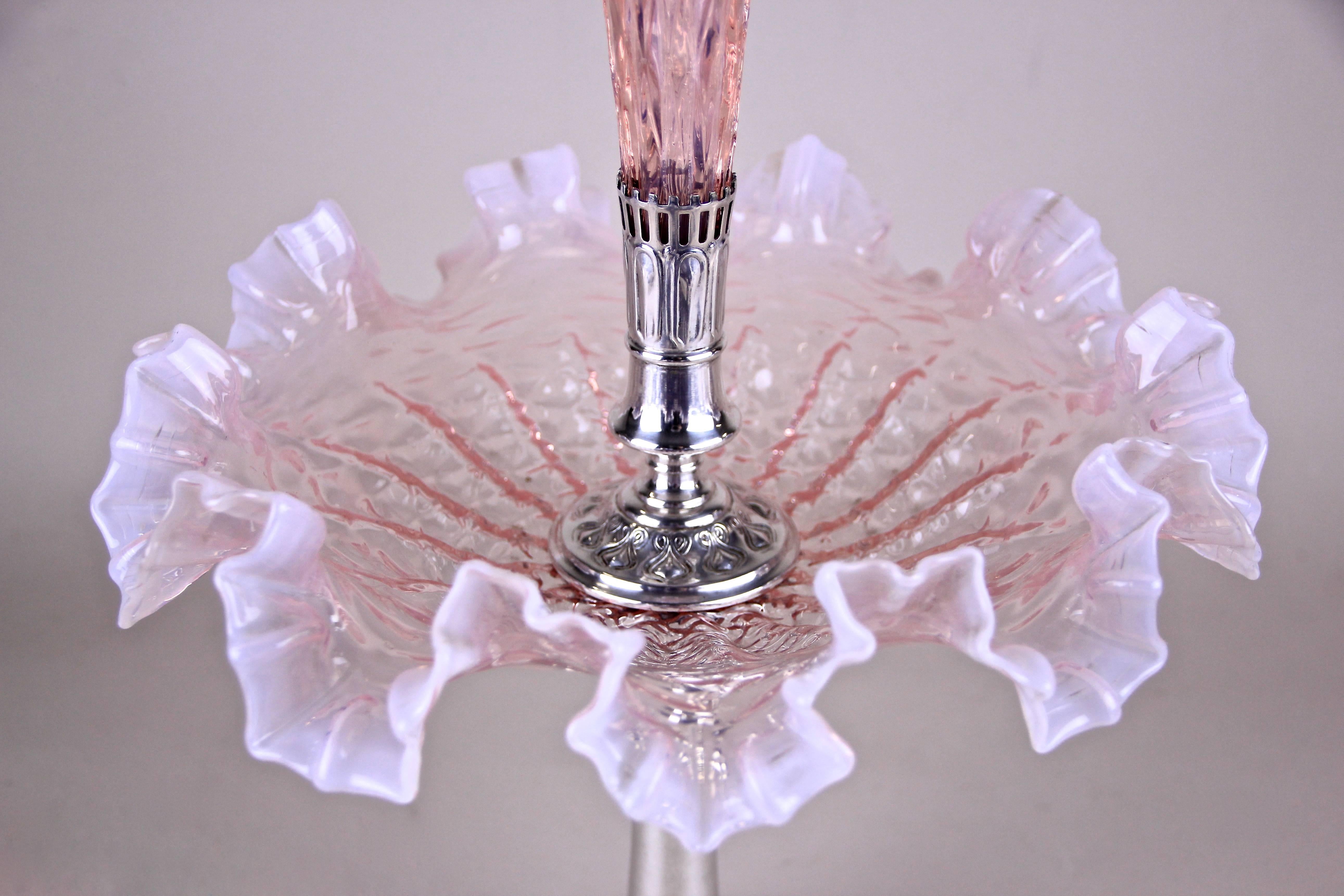 This delightful Art Nouveau Centerpiece was made in the famous city of Vienna by Argentor Austria, circa 1900. The beautiful pastel pink shining mouth blown glass bowl sits on a metal - silver plated centerpiece with great tree embossings around the