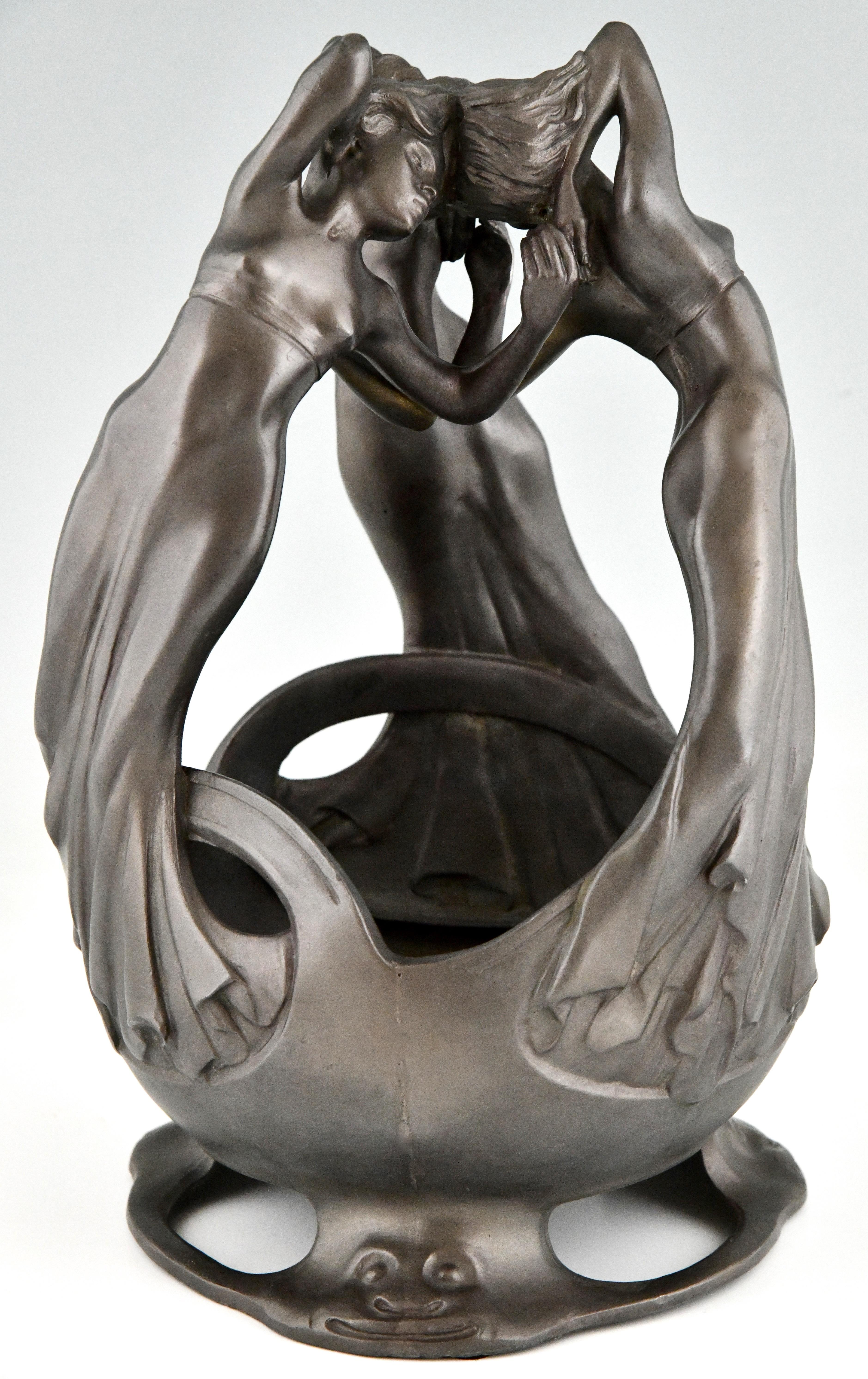 Art Nouveau centerpiece with 3 dancing ladies in pewter by Maurice Maignan.
France ca. 1900.