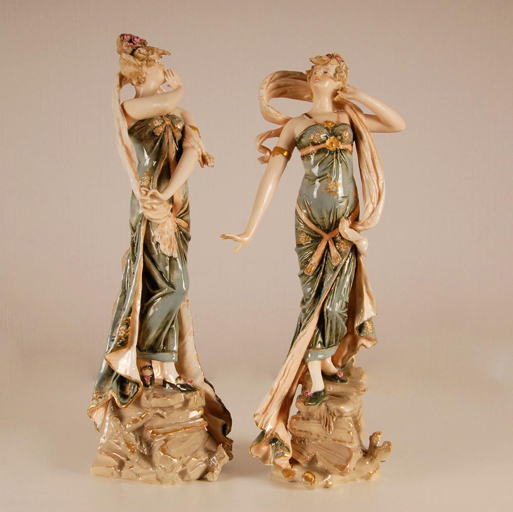 Art Nouveau ceramic figurines Rstk Amphora Austria Turn Teplitz - a pair
Attributed to Riessner, Stellmacher and Kessel for Amphora, Turn Teplitz Austria
The flower pattern which is used is also known by marked Amphora pieces
These figurines are