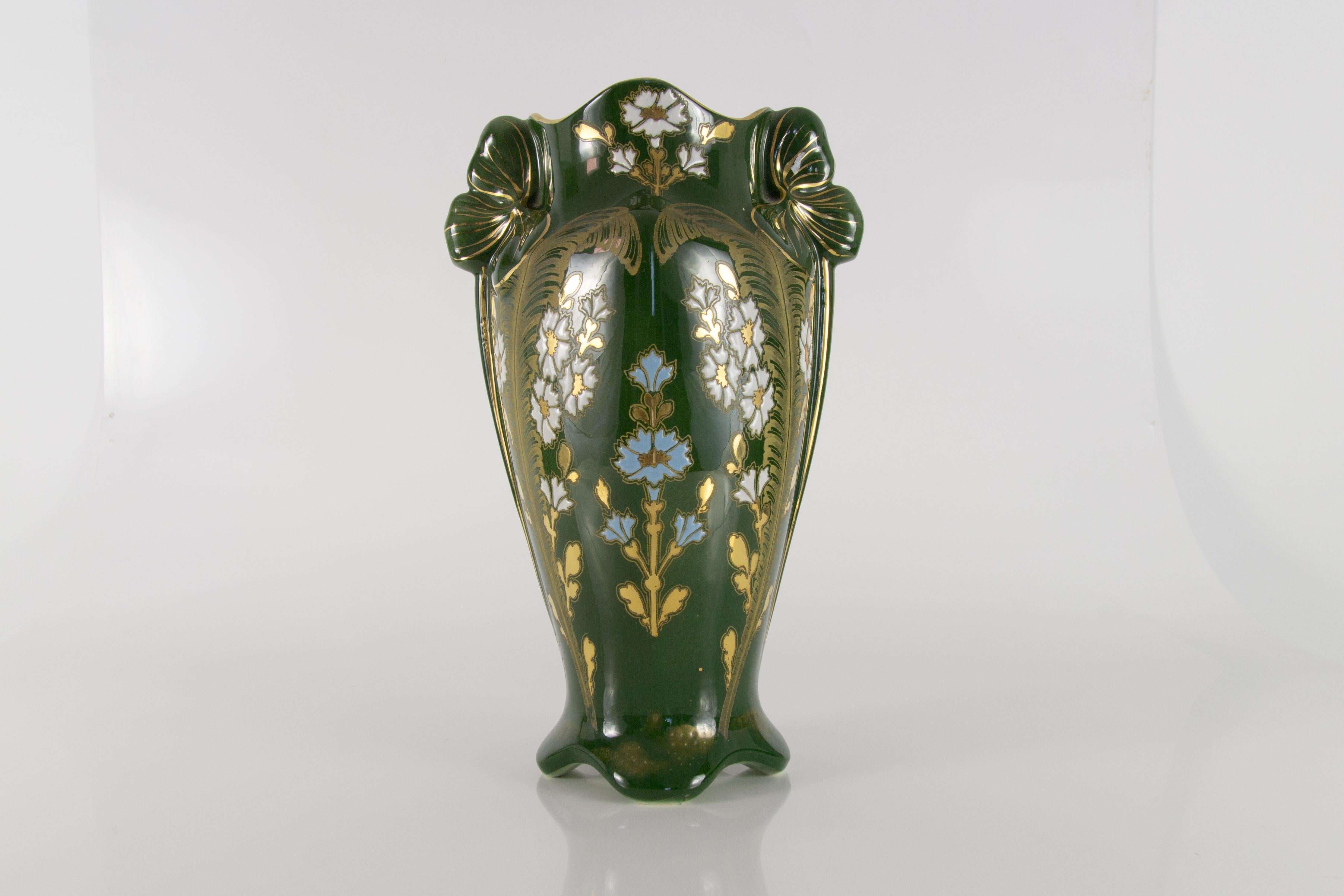 Beautifully glazed Belgian Art Nouveau vase with floral decorations in relief.
Dimensions: diameter of base 12 cm / 4.72 in; height 32 cm / 12.59 in; width 21 cm / 8.26 in x 17 cm / 6.69 in.
  