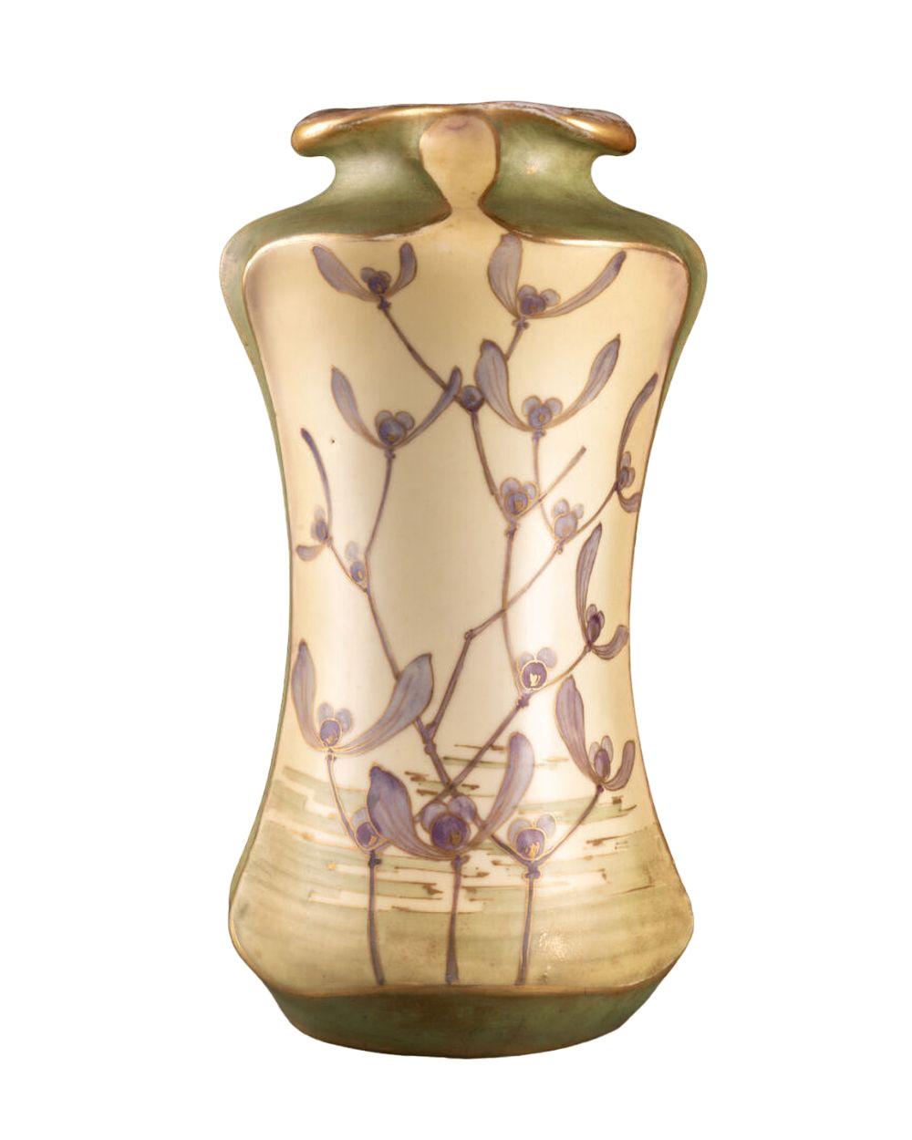 VASE in a stylized plant shape with a hemmed neck Decor of flowering stems against a backdrop of a lake landscape in reserve Glazed ceramic.

Marked on underside Turn Teplitz Bohemia, RStK Made in Austria (for Riessner, Stellmacher & Kessel, mark