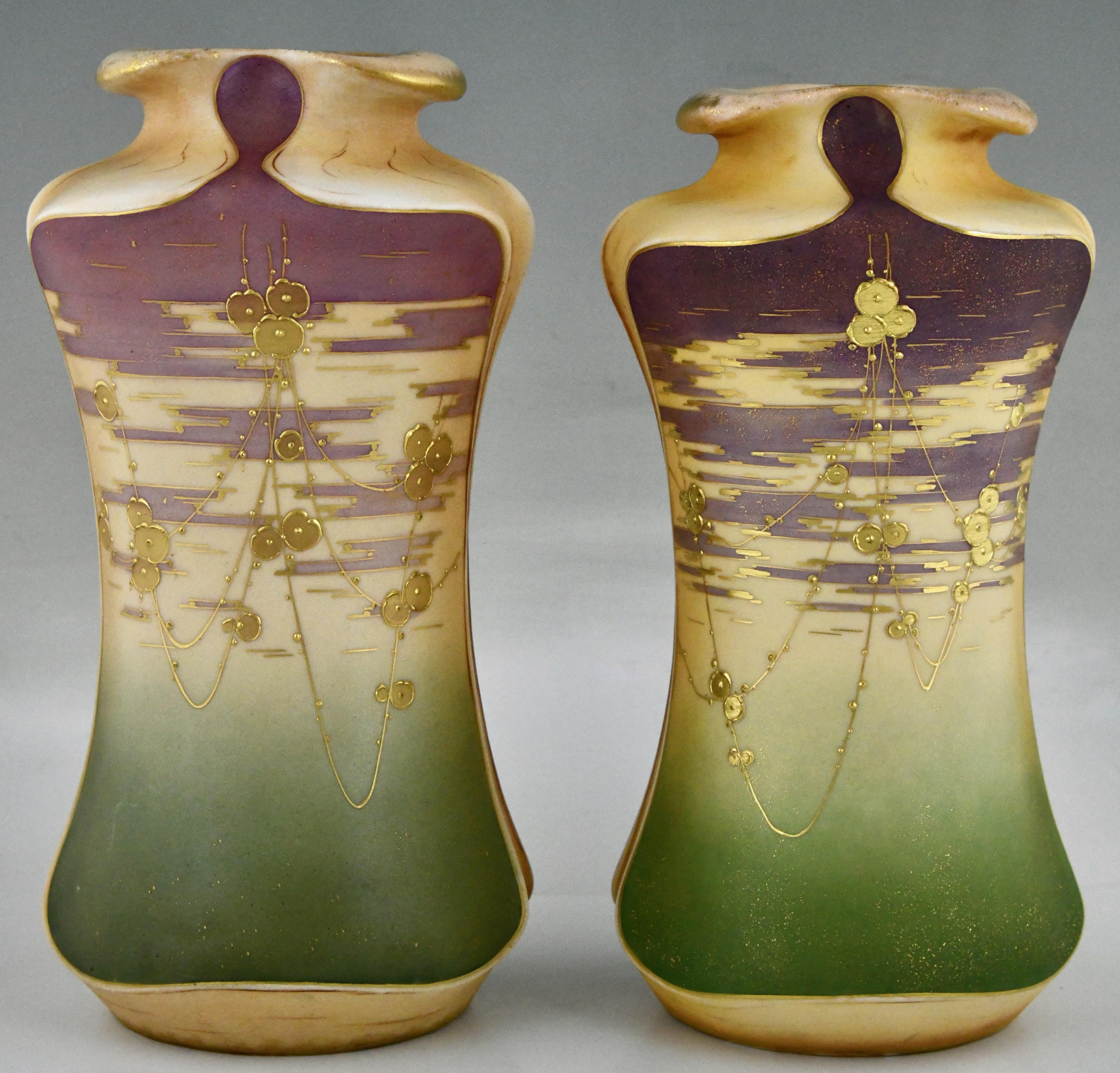 Art Nouveau ceramic vases with gilt flowers by Turn Teplitz marked RStK and Amphora. 
Ceramic, hand-painted green and purple with gilt flowers. 
Austria ca. 1900