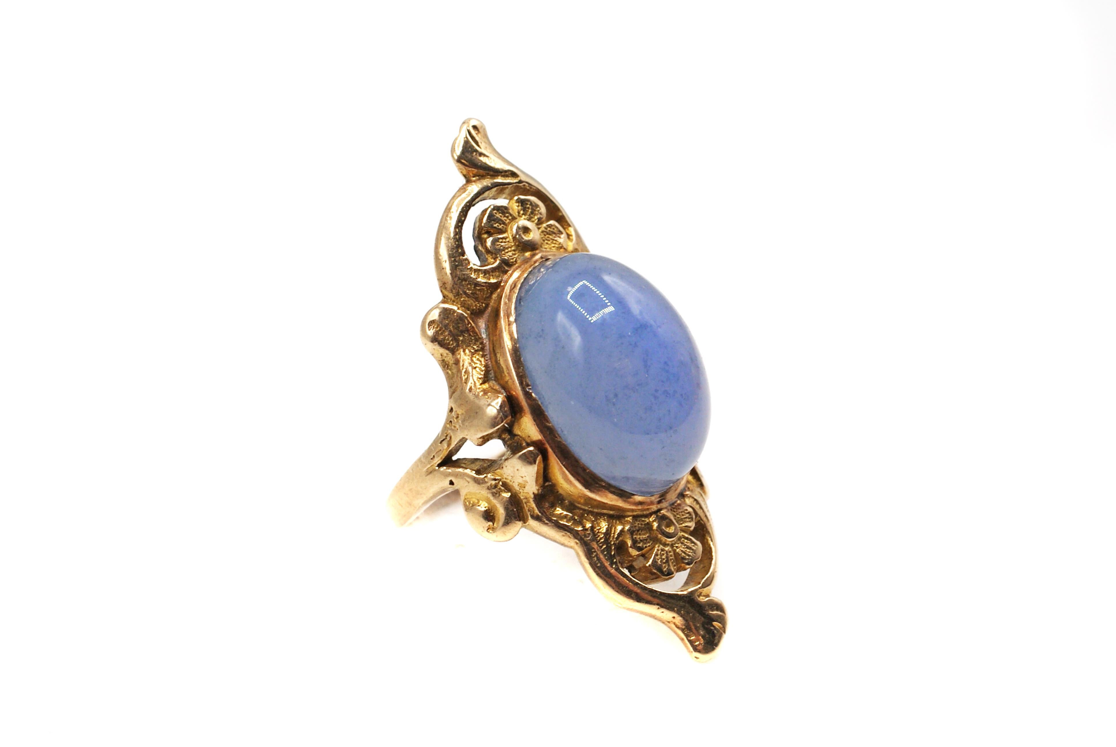 Beautifully designed and handcrafted Art Nouveau ring from ca. 1890, centrally set with Chalcedony cabochon. The gemstone is bezel set and embellished by a wonderful floral design typical for this era. The inside of the shank has a makers-mark which