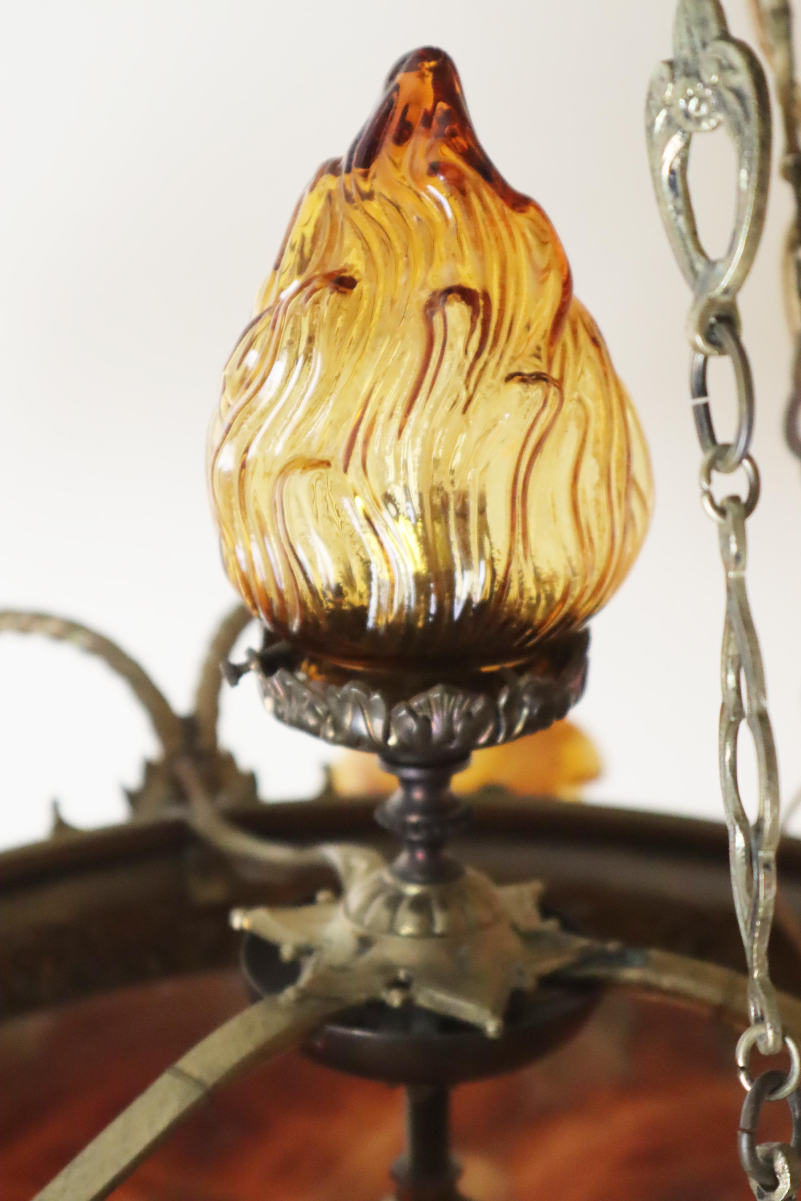 This lovely French chandelier is one of the most beautiful of its time, and it beautifully reflects French Art Nouveau. The six hand-formed blossoms in a beautiful amber tone are a special feature that will bring you joy every day. Despite their