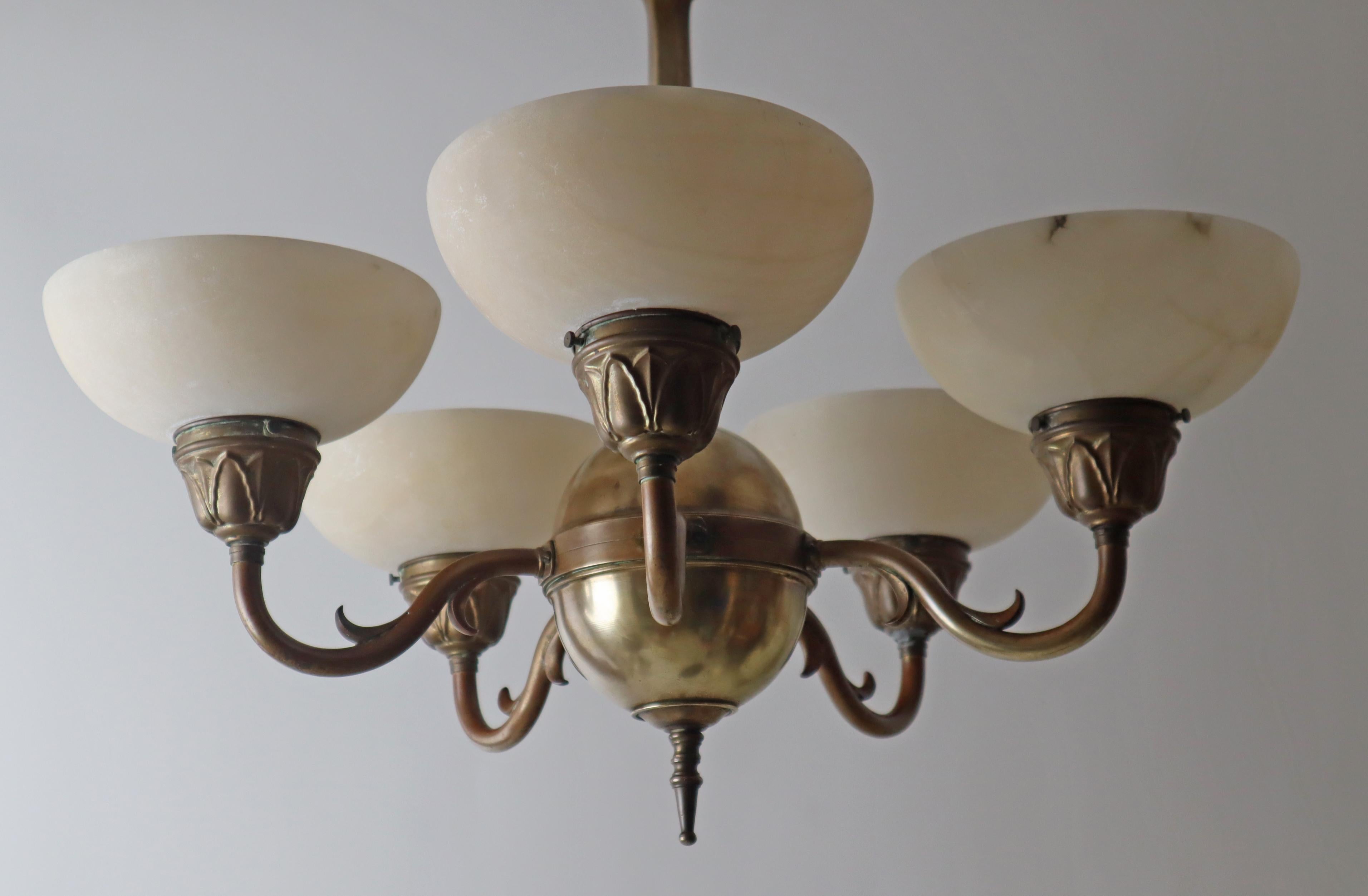 This Art Deco chandelier, which started in the Jugendstil style, is fantastically beautiful, a very early alabaster chandelier from around 1920. The five hand-crafted alabaster bowls are made of particularly beautiful and light alabaster and have