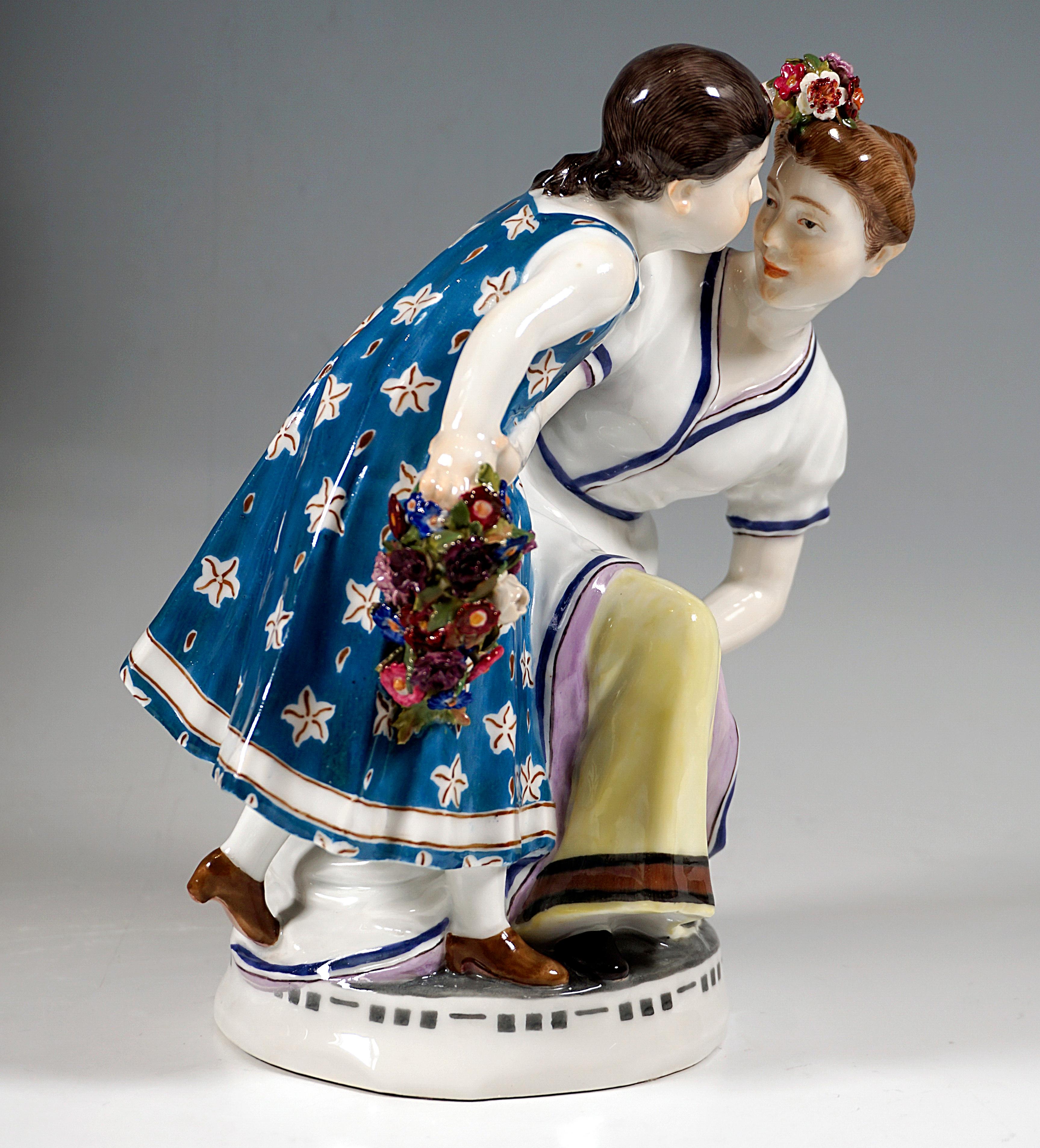 Extremely rare Meissen Art Nouveau porcelain group:
Two girls in clothing of circa 1900, the elder with hair pinned up in a bun in a blue fringed white dress with a yellow petticoat crouching next to a little girl in a blue dress with white