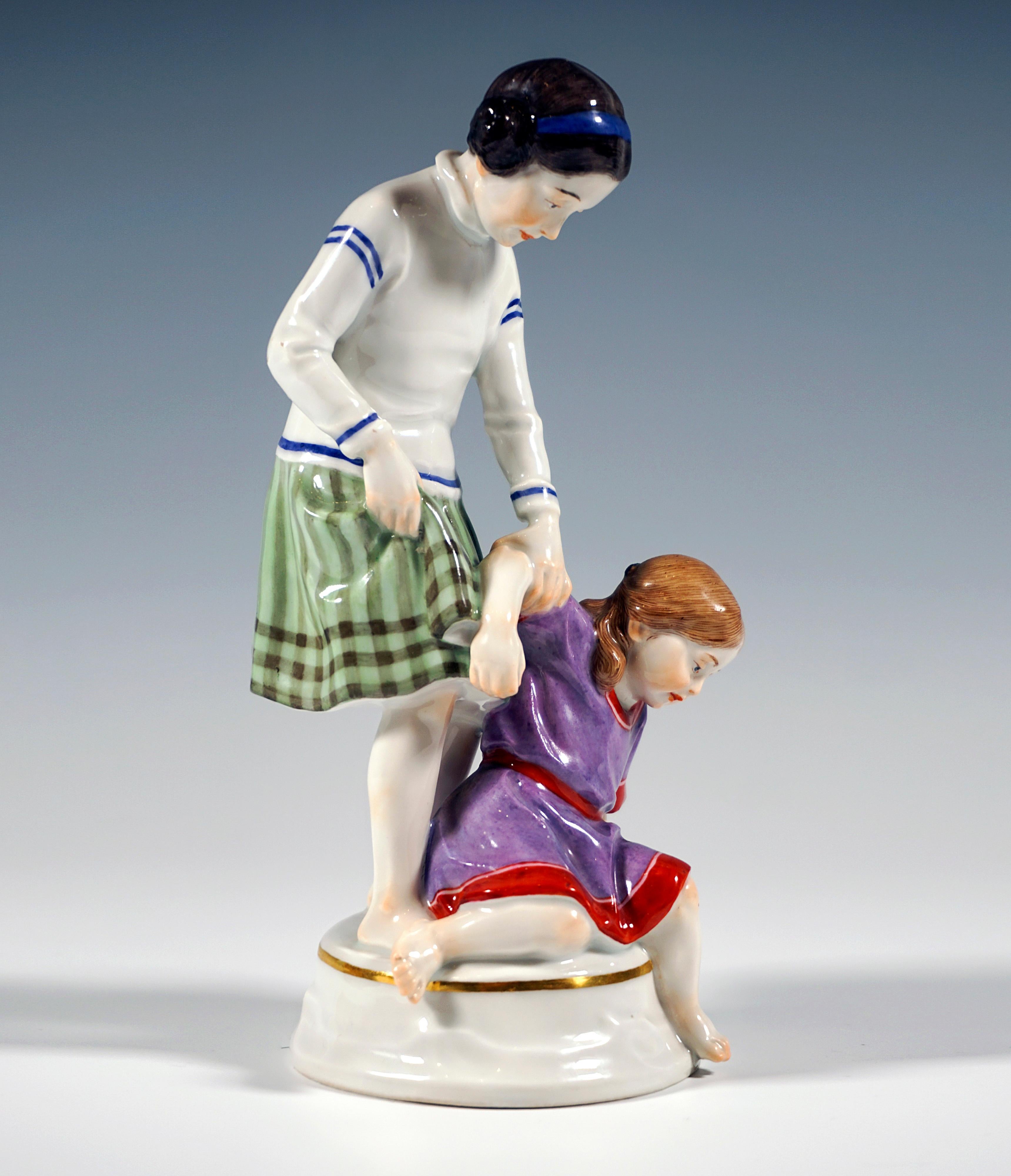 Very rare Meissen Art Nouveau porcelain figure group:
Two barefoot girls in summer clothes, the older one in a green-brown skirt and white long-sleeved shirt with blue stripes, her hair pinned up in two side bunches, the younger child in a