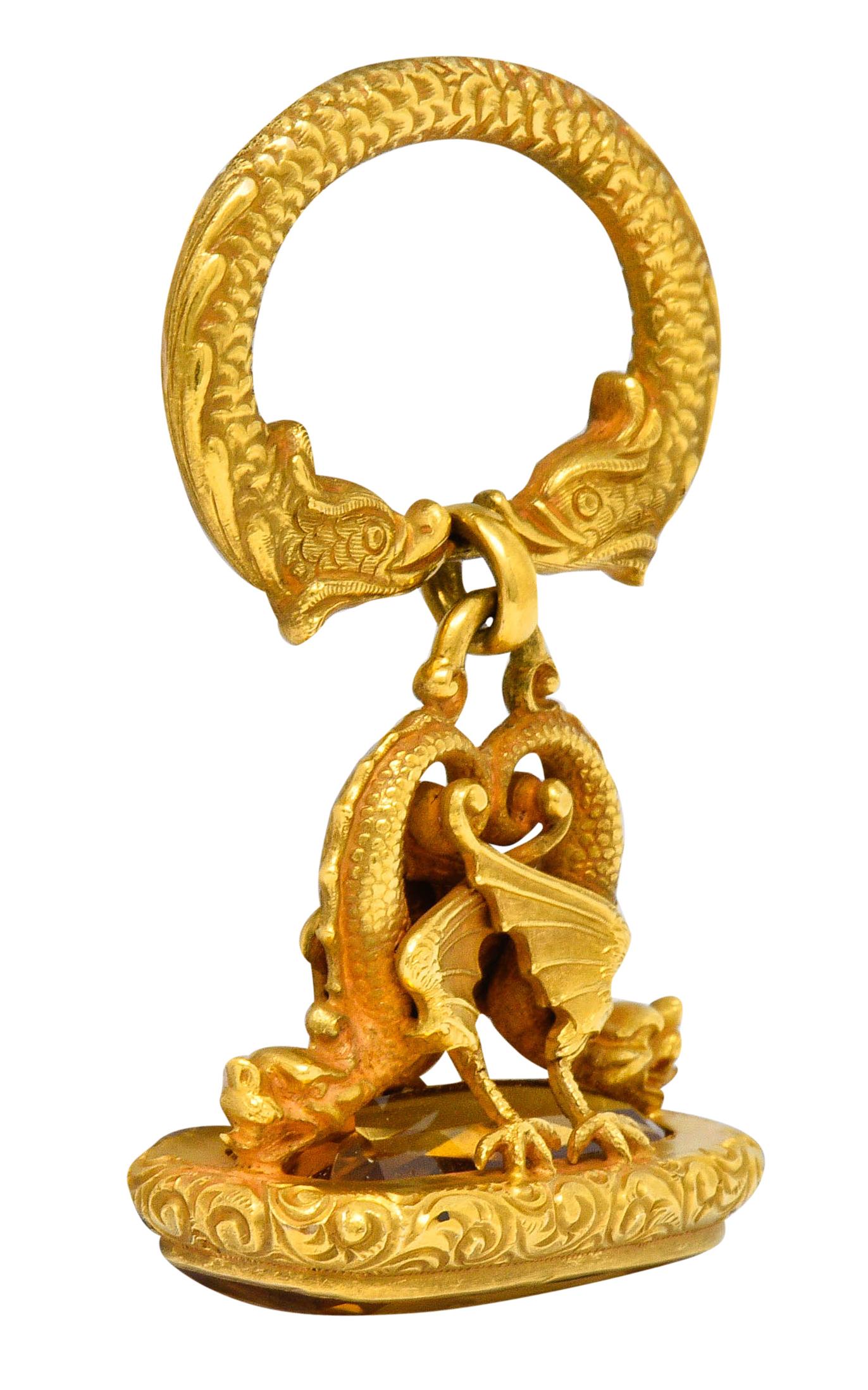 Pendant is designed as two stylized fish creating a door-knocker style bale

Suspending a fob comprised of two mirrored serpent dragons on a deeply engraved base
Incredibly detailed with scrolled reptilian tails, ridged wings, and scalloped