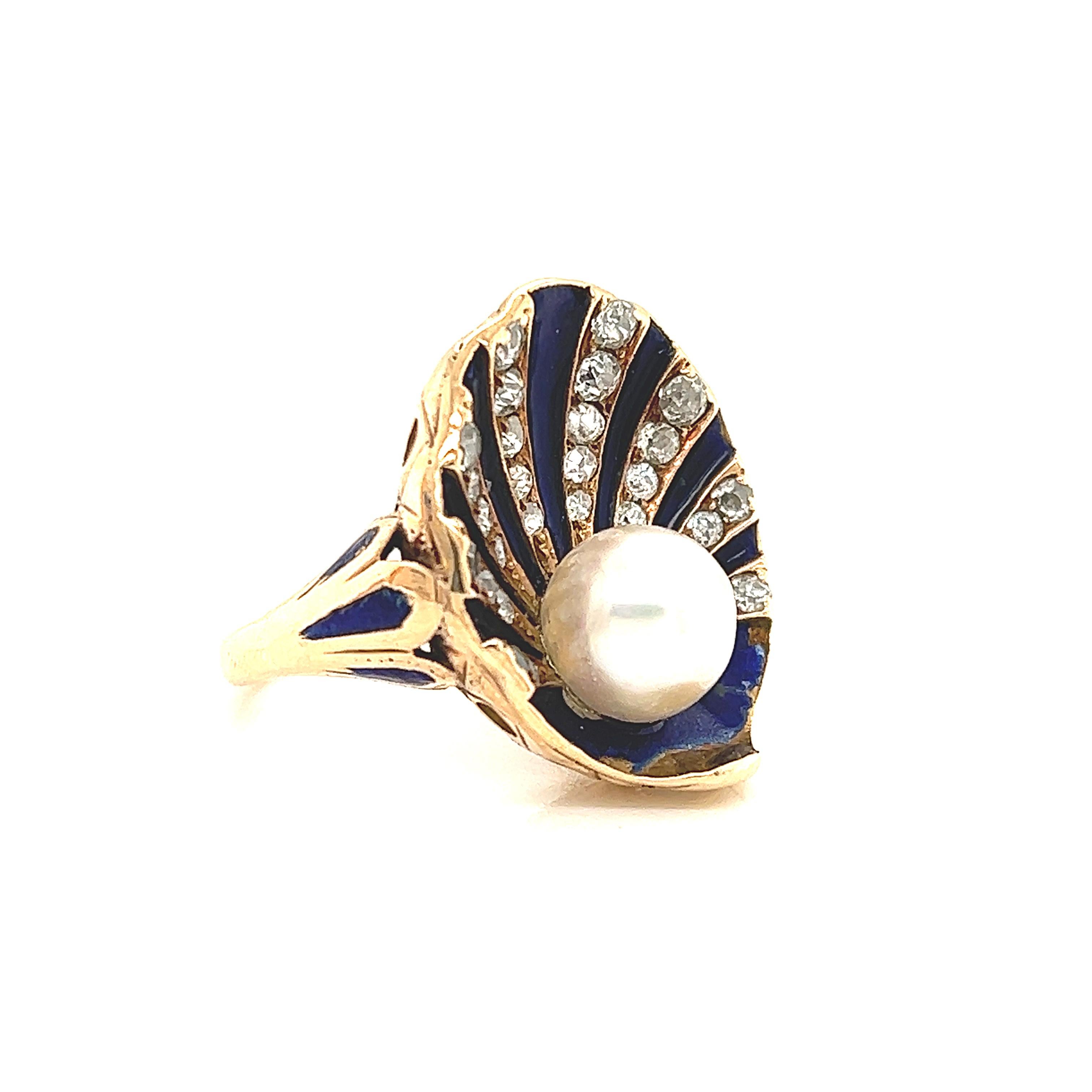 Gorgeous design seen on this vintage treasure. This Art Nouveau ring is crafted in the theme of an under water clam shell with details seen throughout. Highlighting this ring is a center round pearl with exceptional luster.  The ring is adorned with